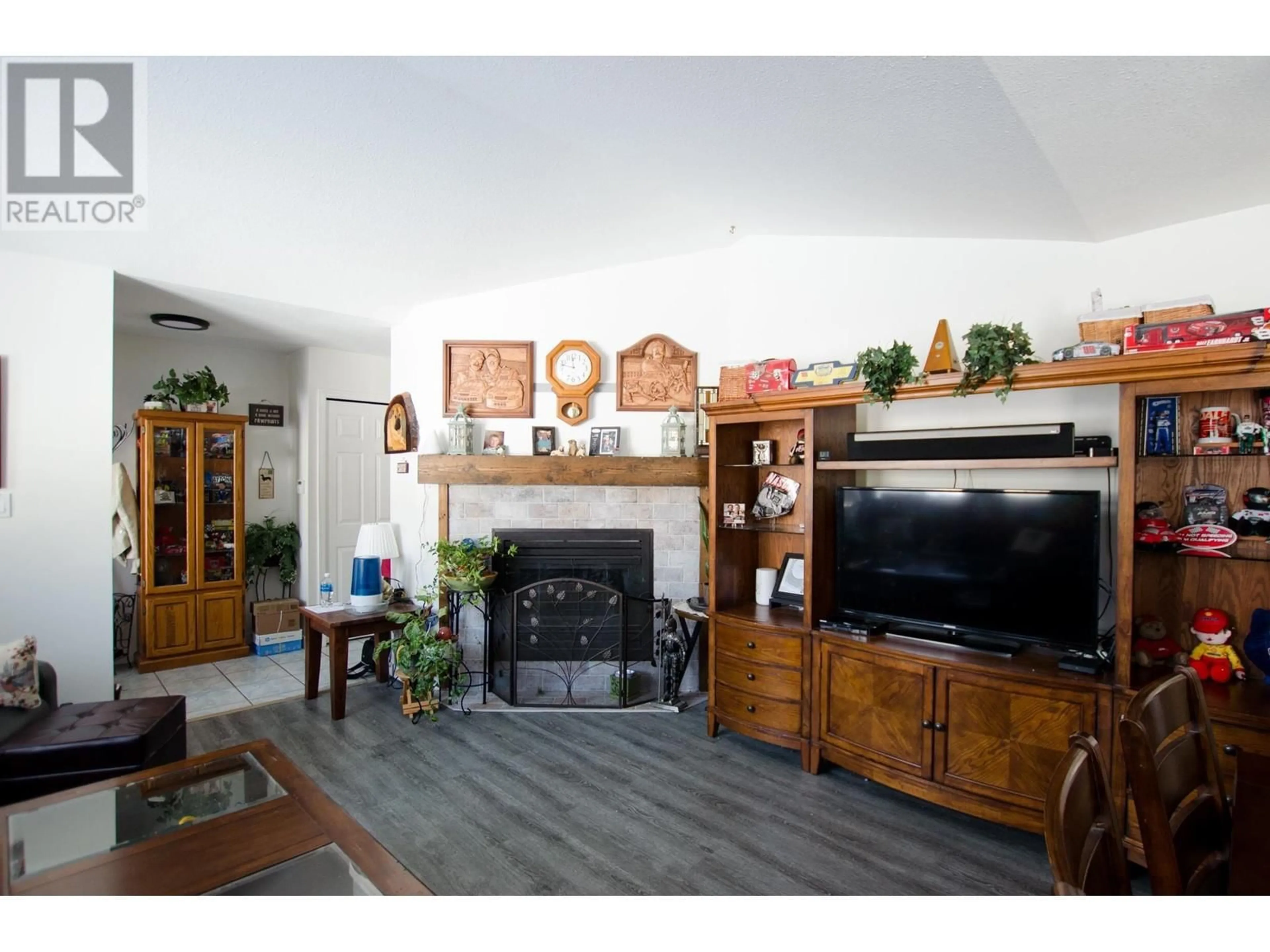 Living room with furniture, wood/laminate floor for 2045 CROFT ROAD, Prince George British Columbia V2K3C8