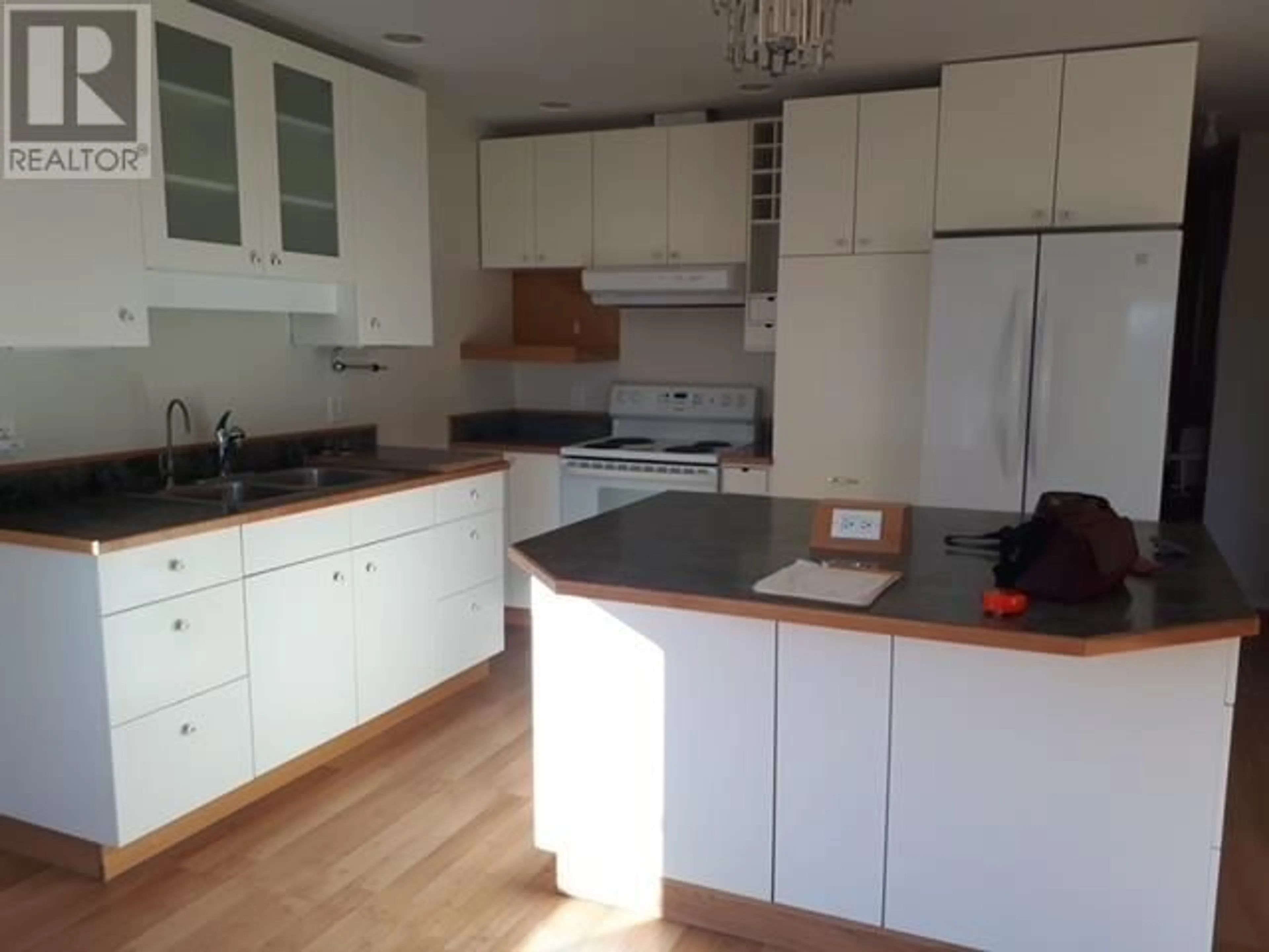 Standard kitchen, wood/laminate floor for 4765 TELQUA DRIVE, 108 Mile Ranch British Columbia V0K2Z0