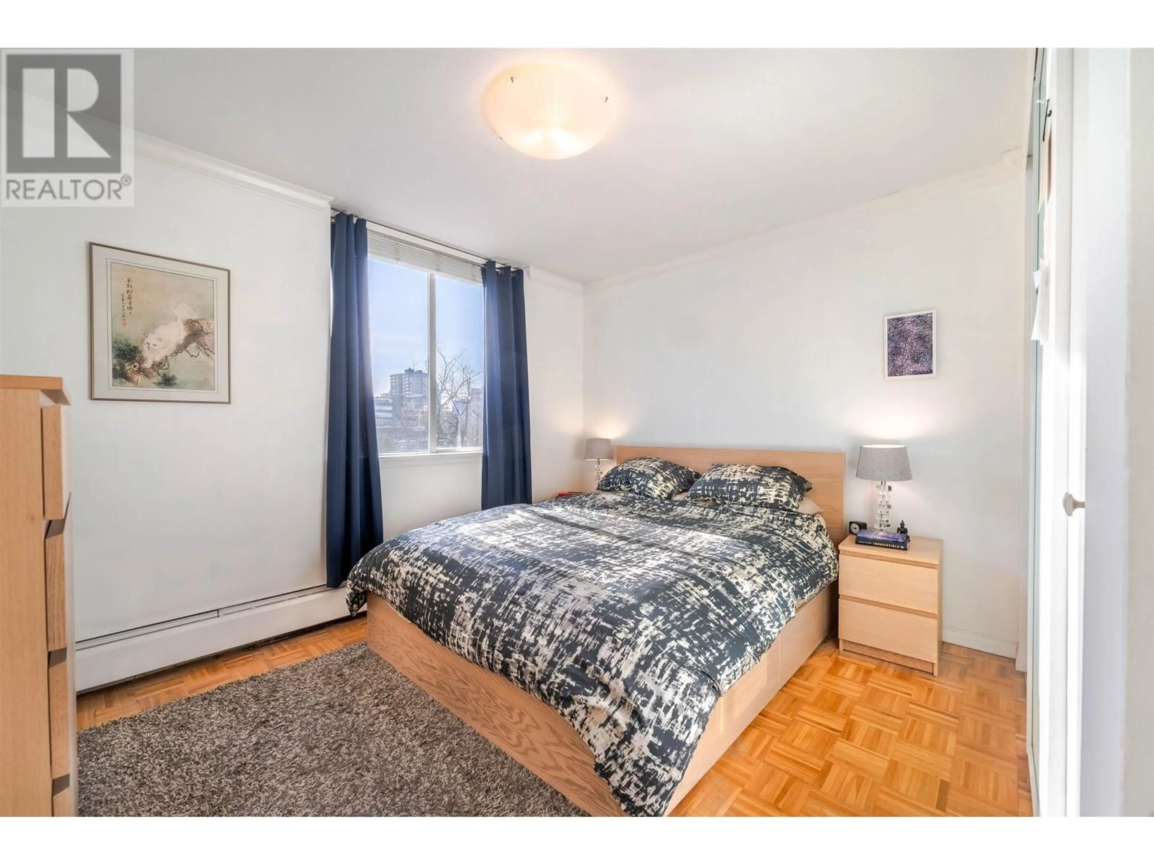 Bedroom with bed, wood/laminate floor for 605 - 1251 CARDERO STREET, Vancouver British Columbia V6G2H9