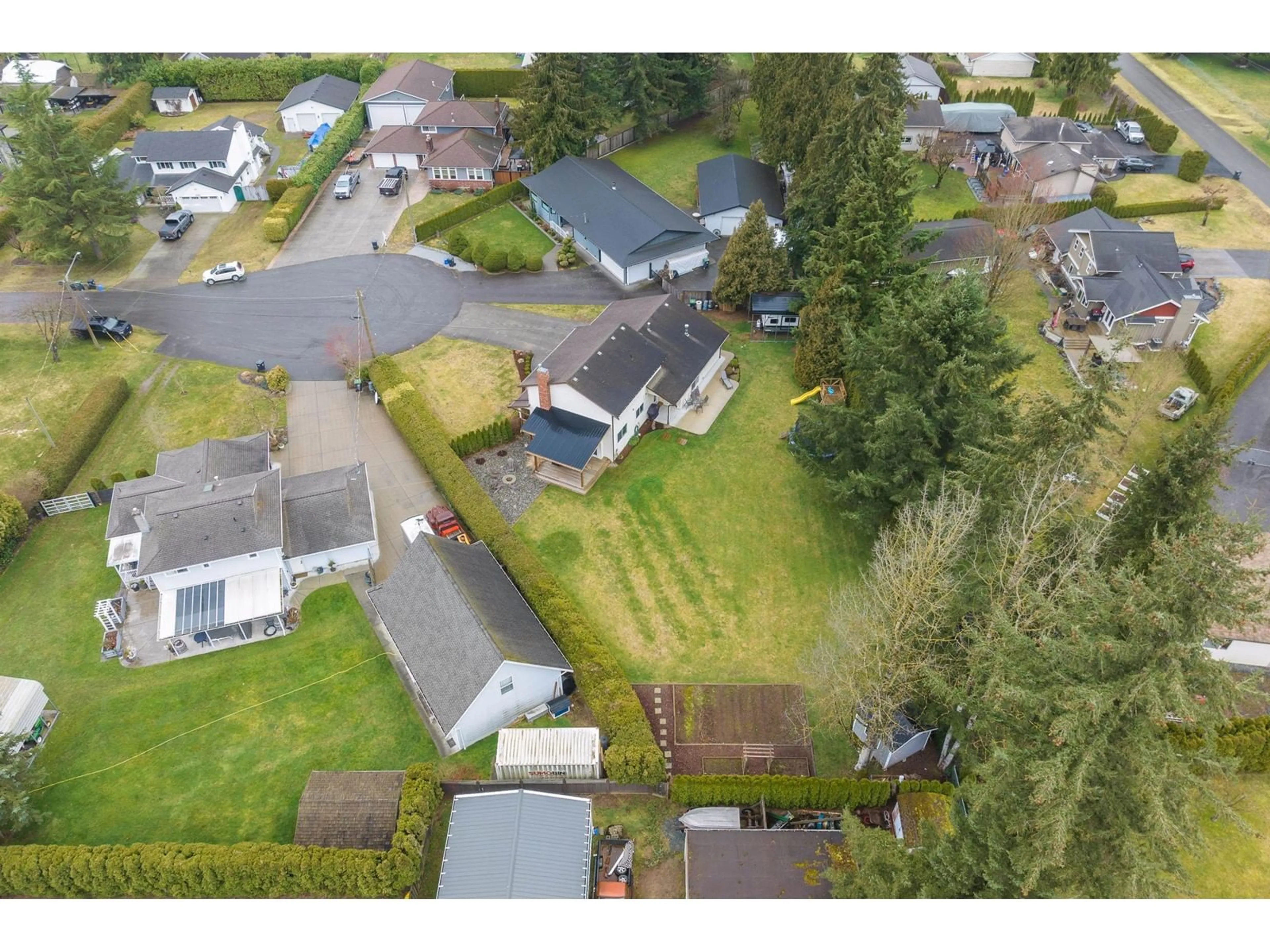 A pic from outside/outdoor area/front of a property/back of a property/a pic from drone, street for 5714 247A, Langley British Columbia V2Z1H2