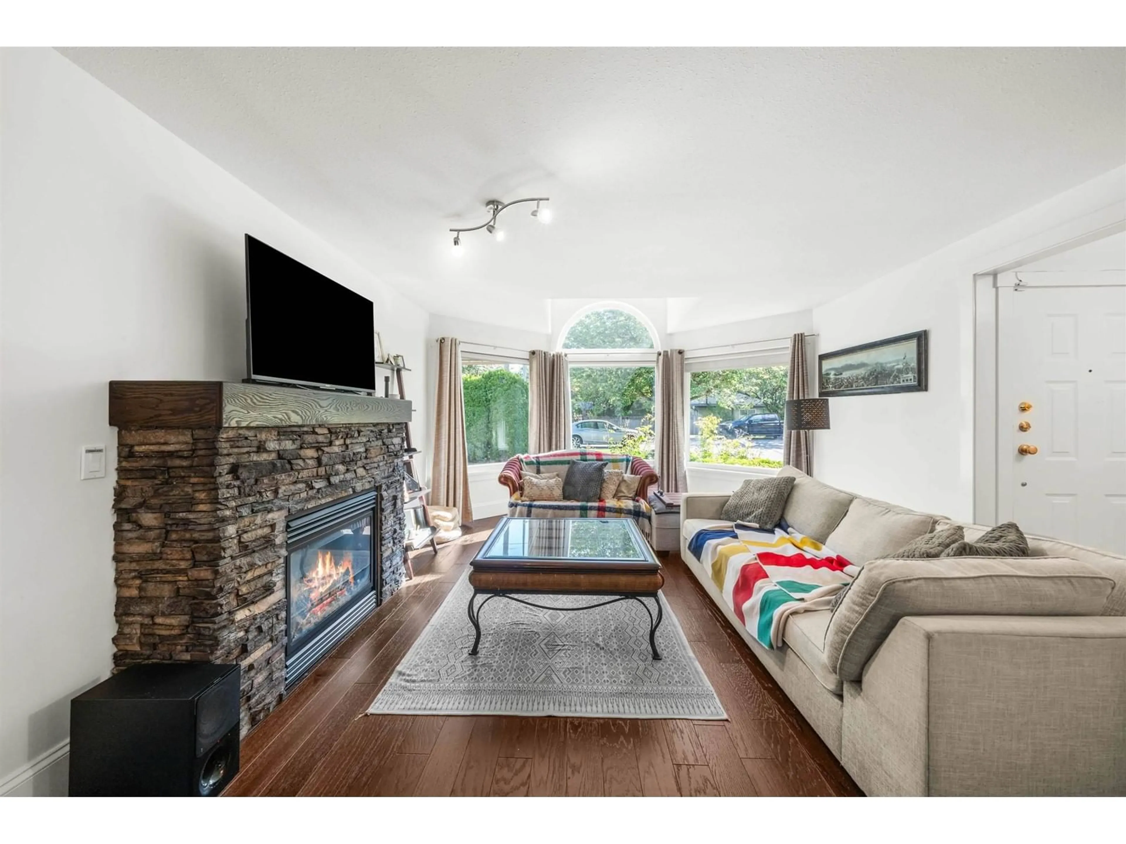 Living room with furniture, wood/laminate floor for 22109 OLD YALE, Langley British Columbia V2Z1A3