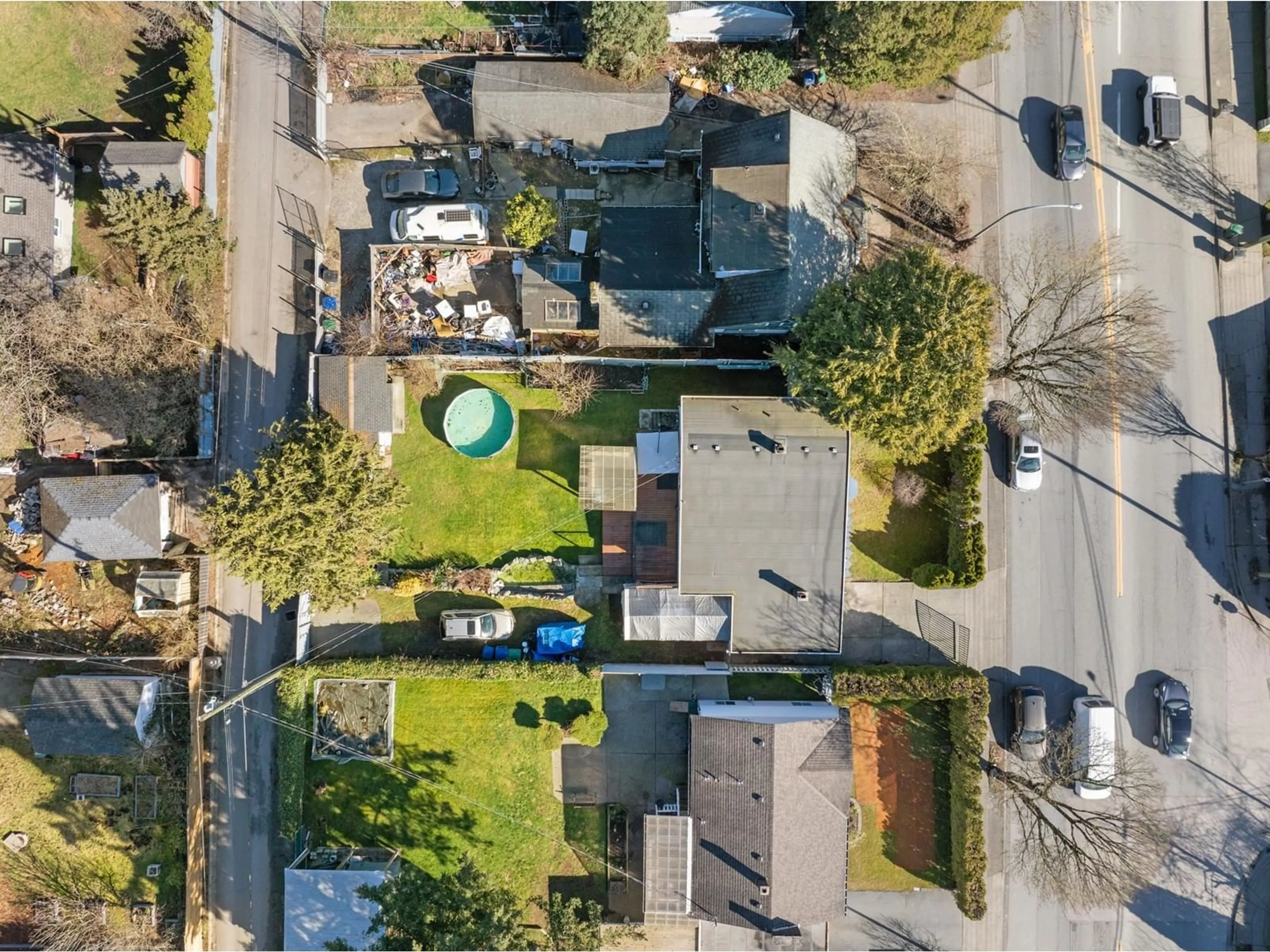 A pic from outside/outdoor area/front of a property/back of a property/a pic from drone, street for 12905 104 AVENUE, Surrey British Columbia V3T1T6