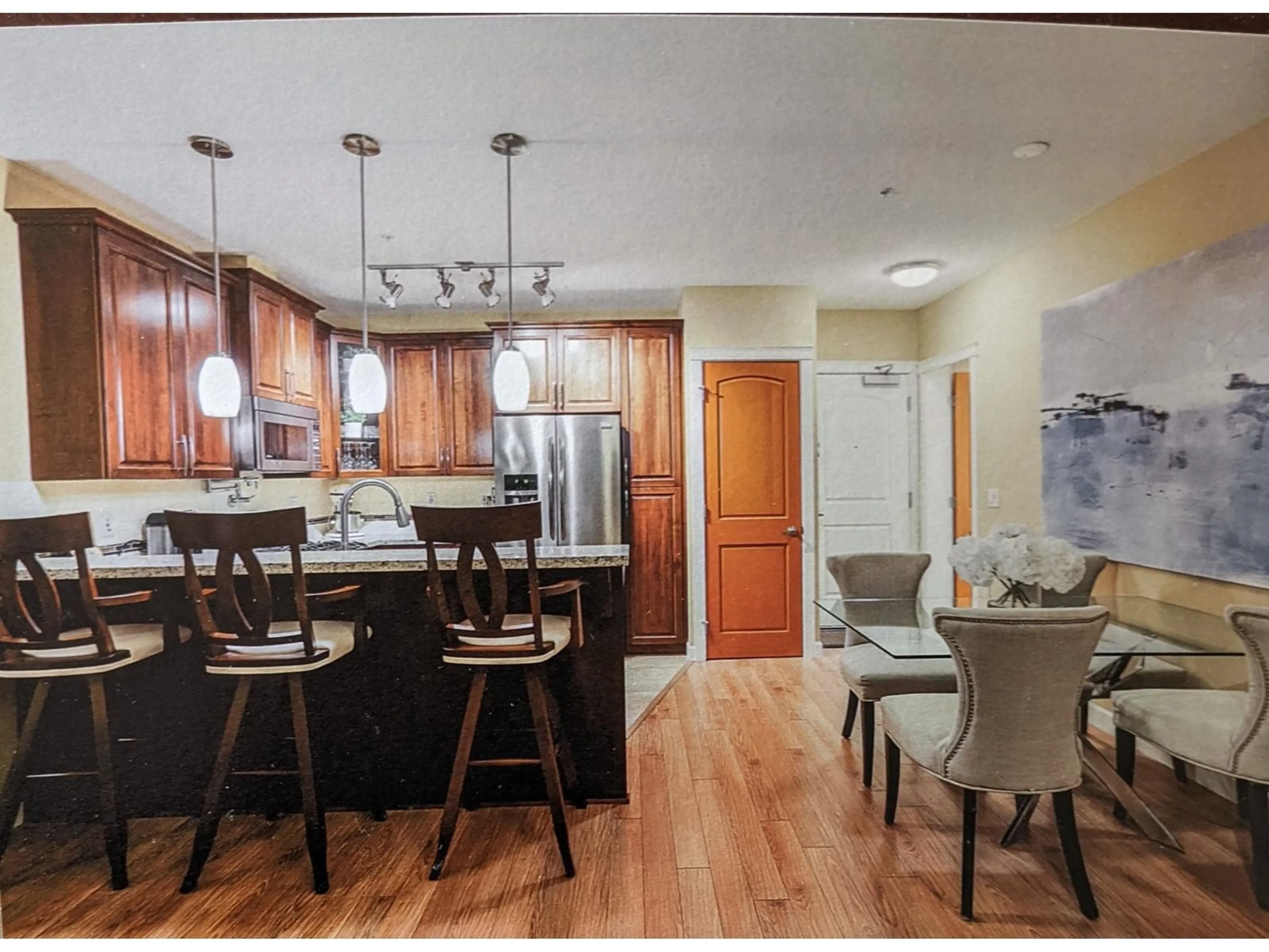 Open concept kitchen, wood/laminate floor for 219 - 2860 TRETHEWEY, Abbotsford British Columbia V2T0G5