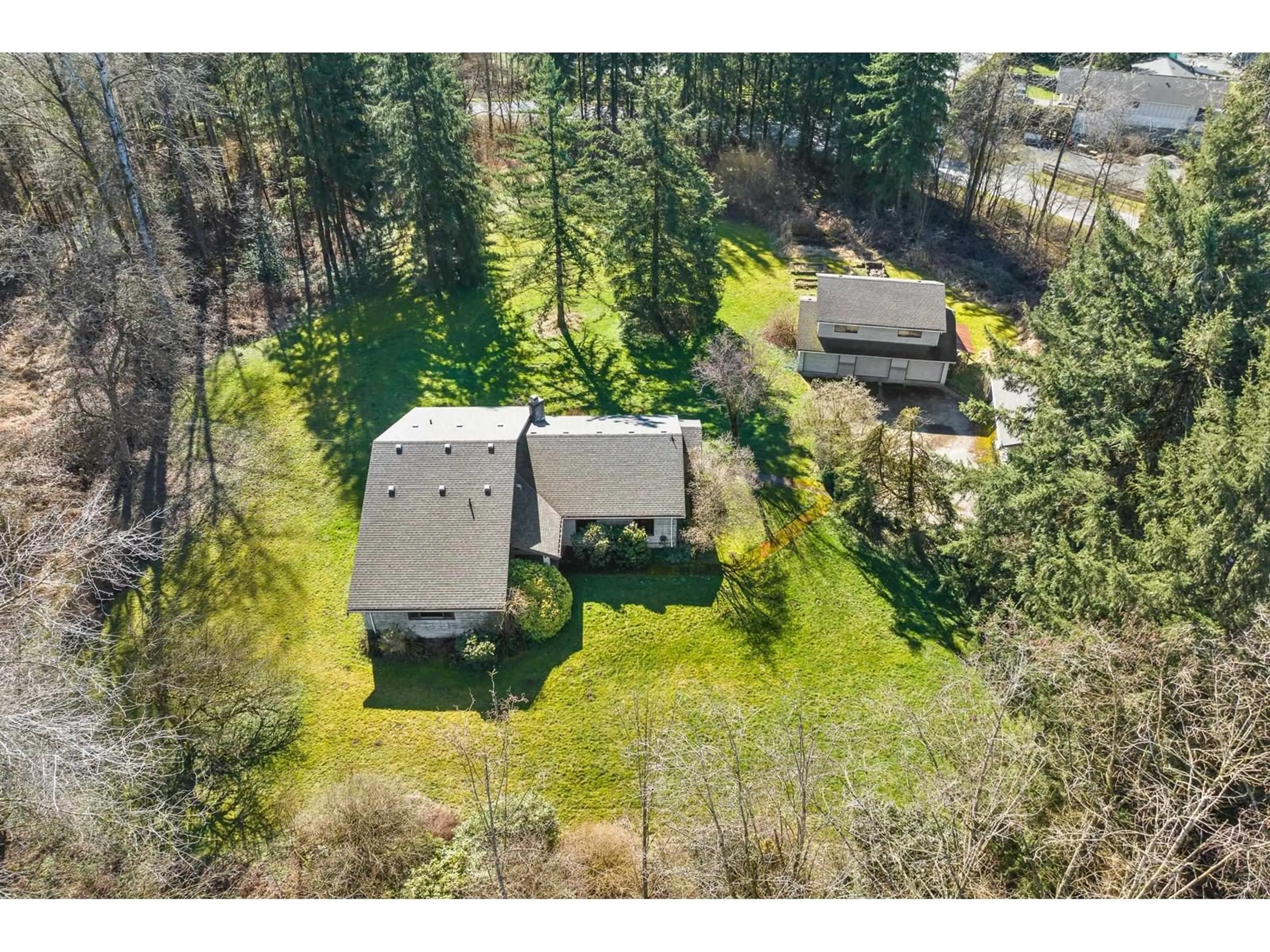 A pic from outside/outdoor area/front of a property/back of a property/a pic from drone, forest/trees view for 7024 HESSLEA CRESCENT, Abbotsford British Columbia V3A2V3