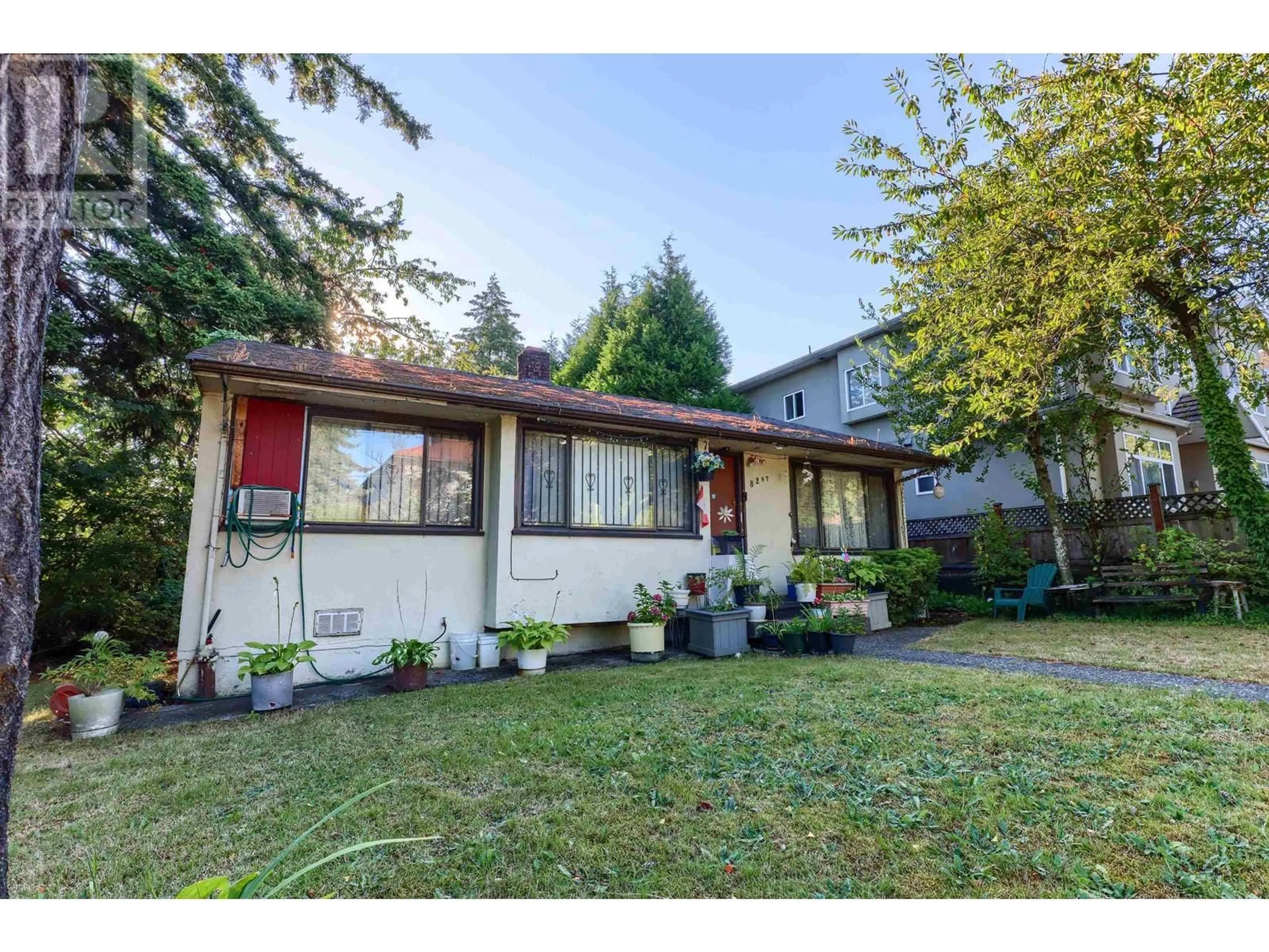 Home with vinyl exterior material, street for 8287 VICTORIA DRIVE, Vancouver British Columbia V5P4A7