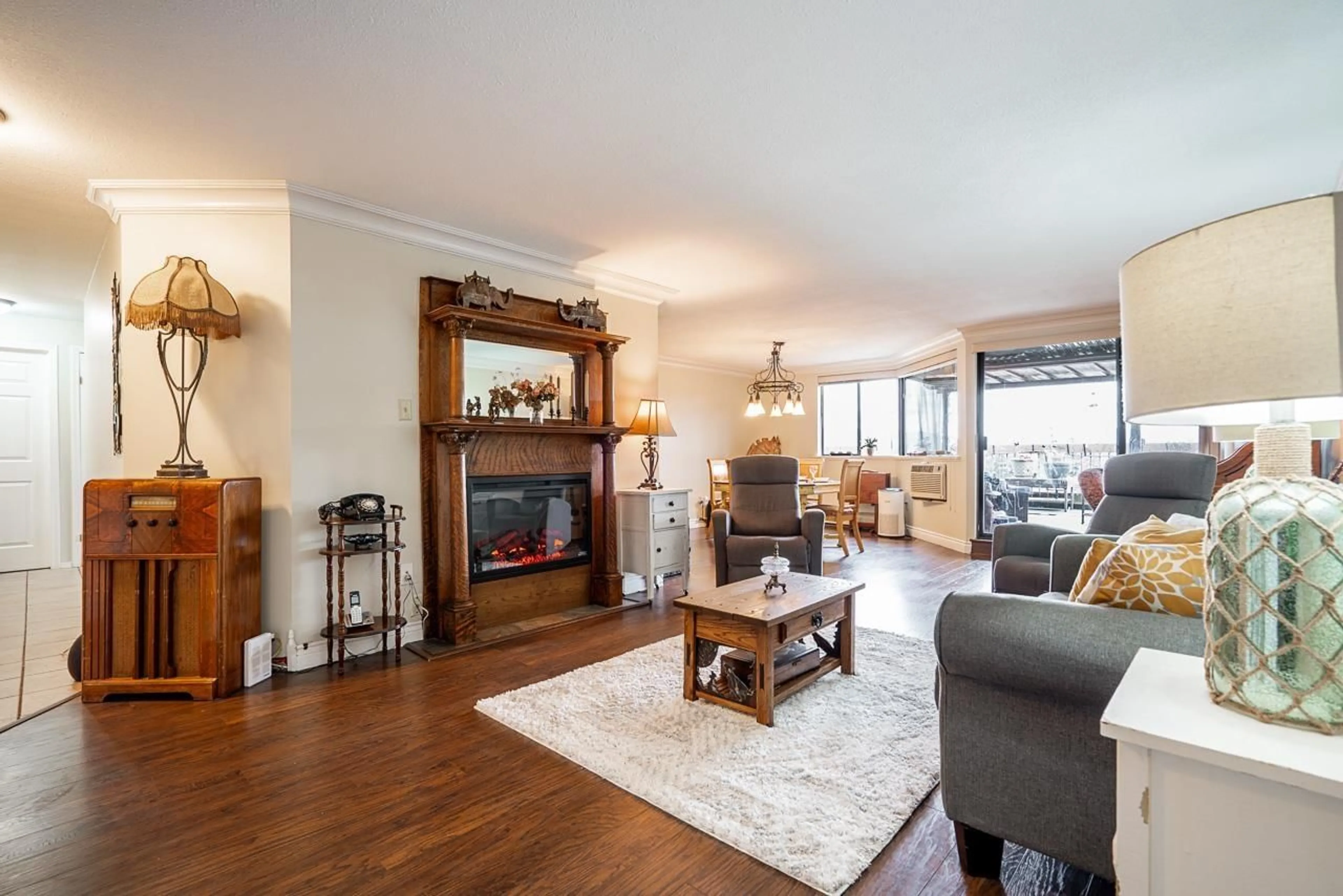 Living room with furniture, wood/laminate floor for 901 - 31955 OLD YALE, Abbotsford British Columbia V2T4N1