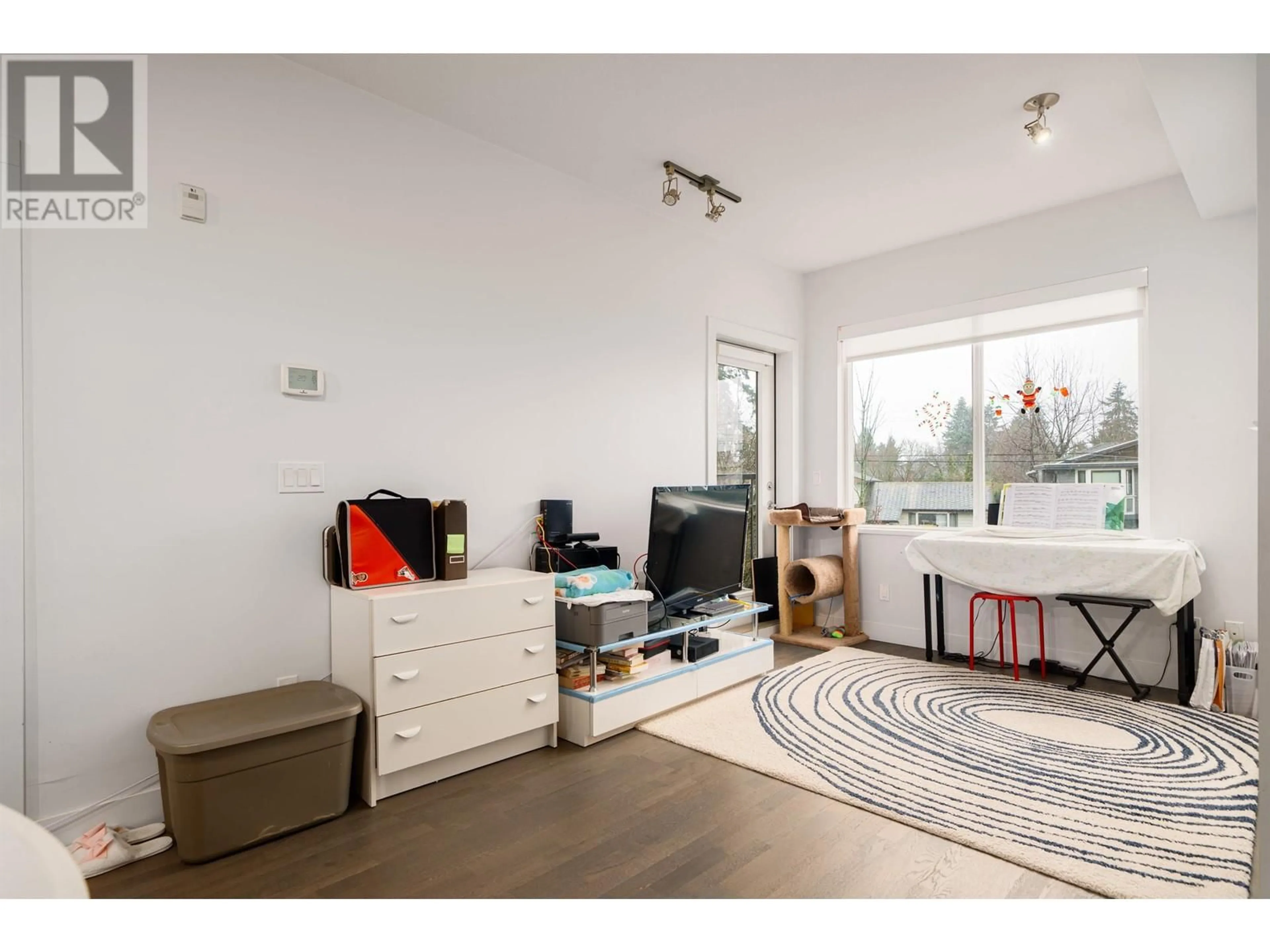 Living room with furniture, unknown for 105 - 10011 RIVER DRIVE, Richmond British Columbia V6X0N2