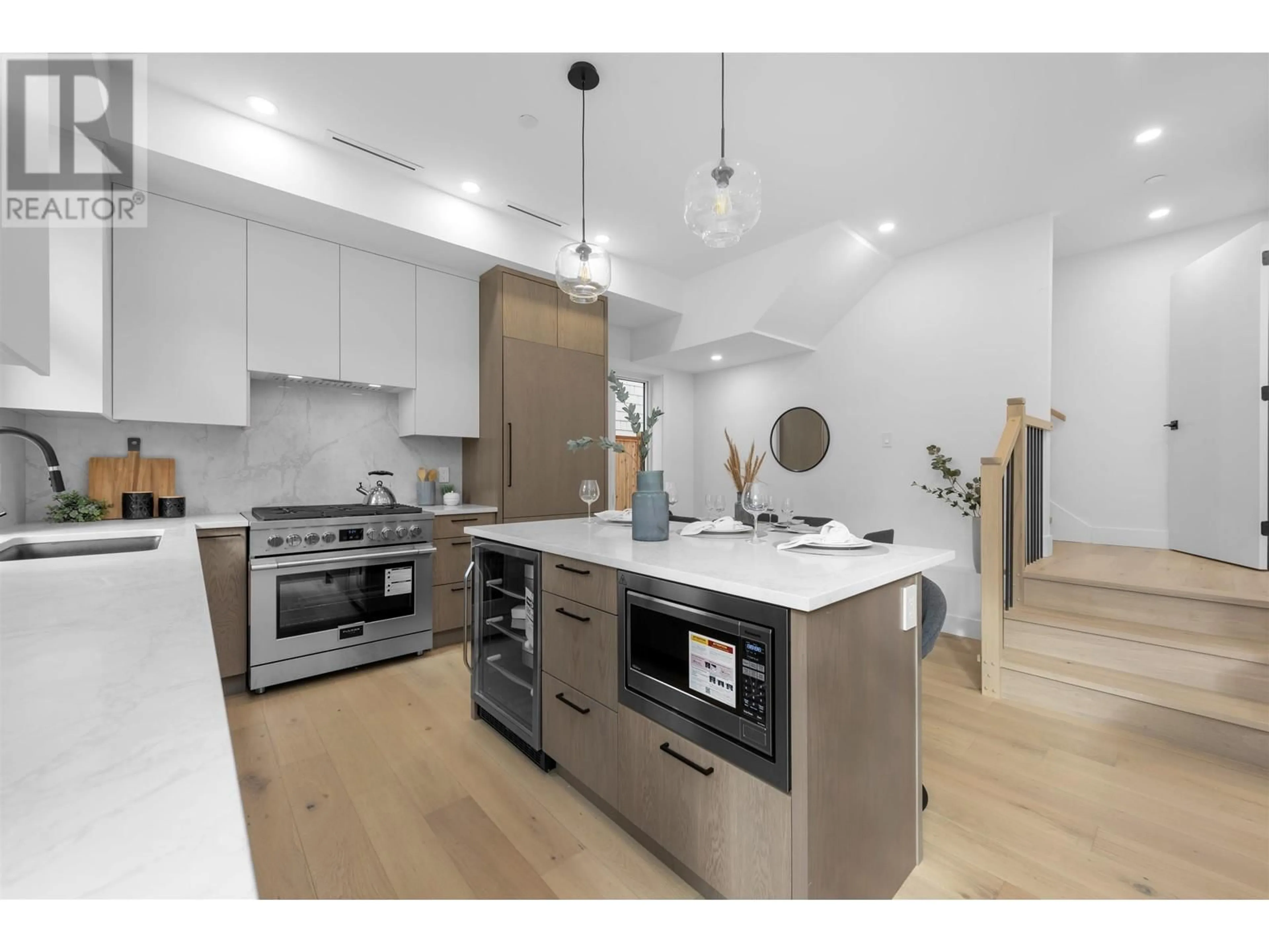 Open concept kitchen, wood/laminate floor for 2 1328 E 35TH AVENUE, Vancouver British Columbia V5W1C1