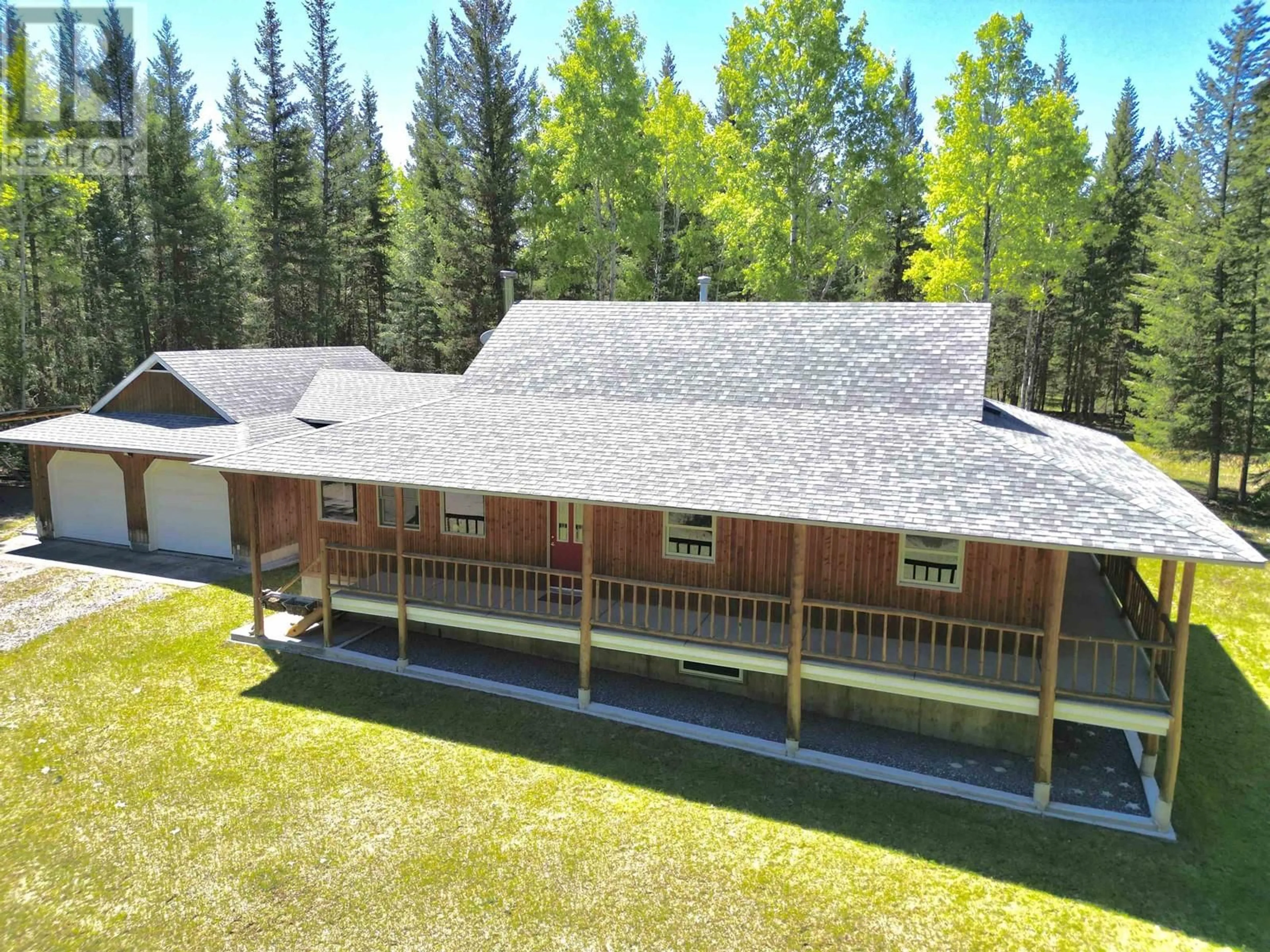A pic from outside/outdoor area/front of a property/back of a property/a pic from drone, unknown for 3338 PIGEON ROAD, 150 Mile House British Columbia V0K2G0