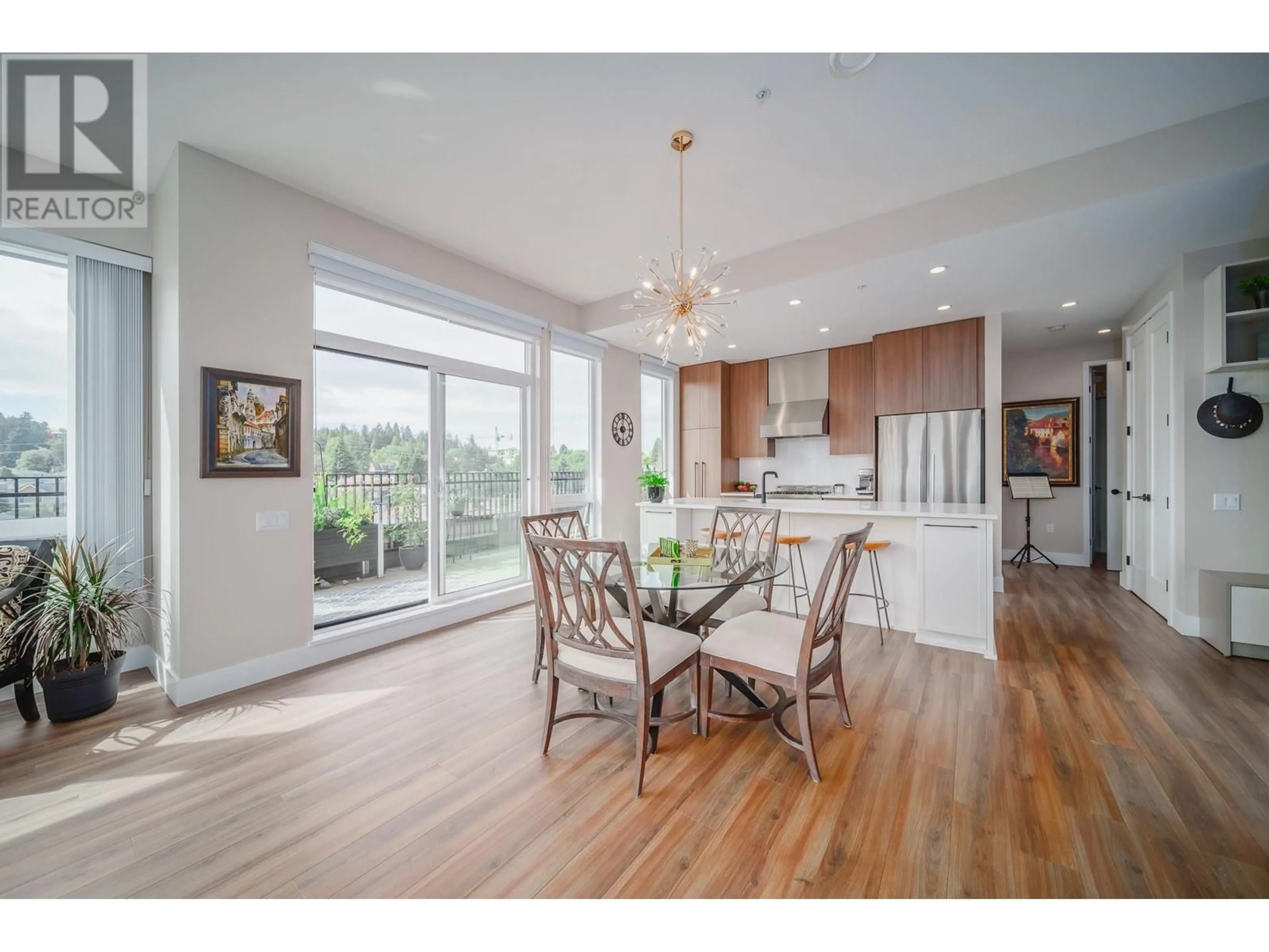 Open concept kitchen, wood/laminate floor for 403 - 288 KING EDWARD AVENUE, Vancouver British Columbia V5Y2J2
