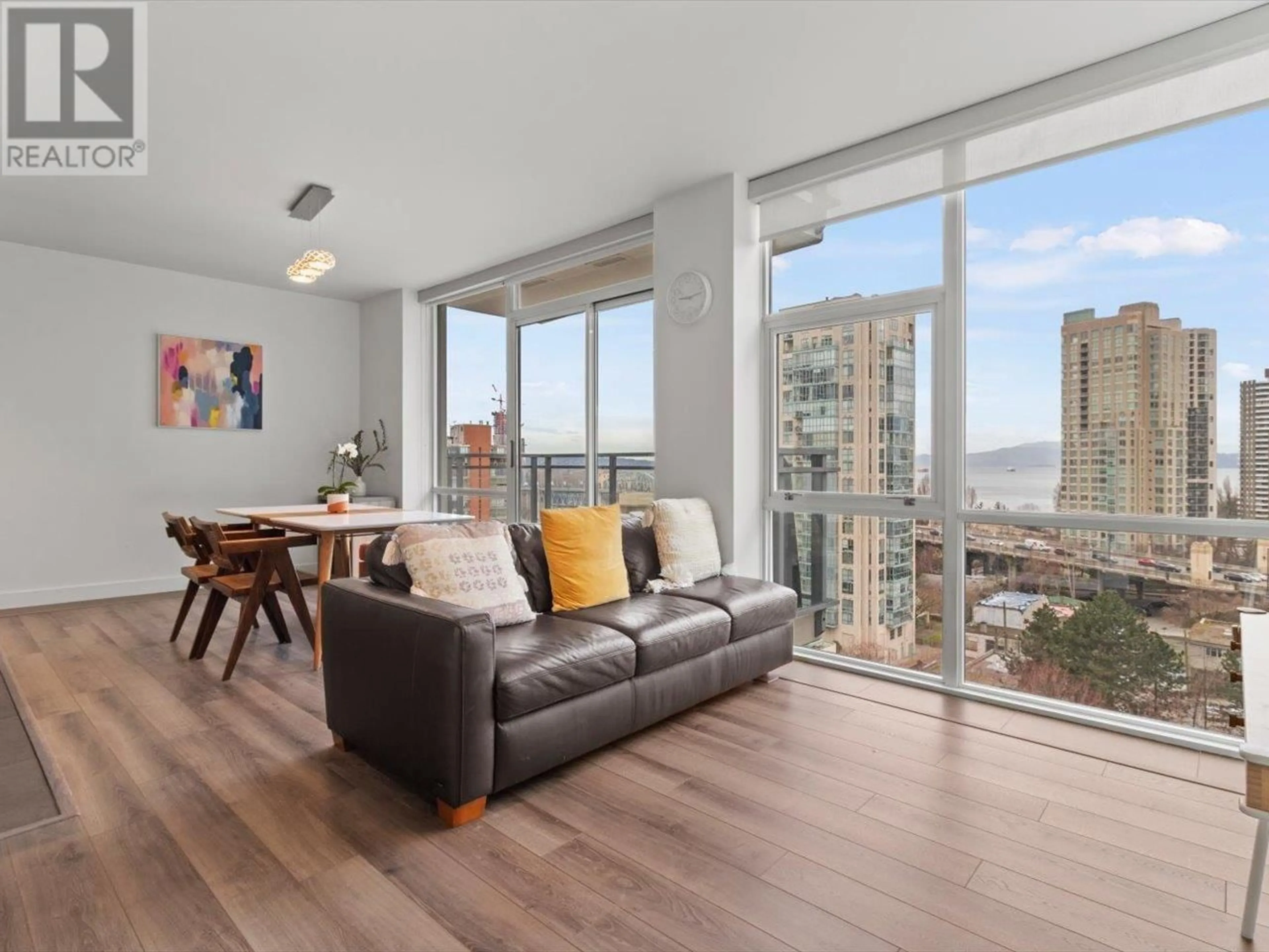 Living room with furniture, wood/laminate floor for 1201 1455 HOWE STREET, Vancouver British Columbia V6Z1C2