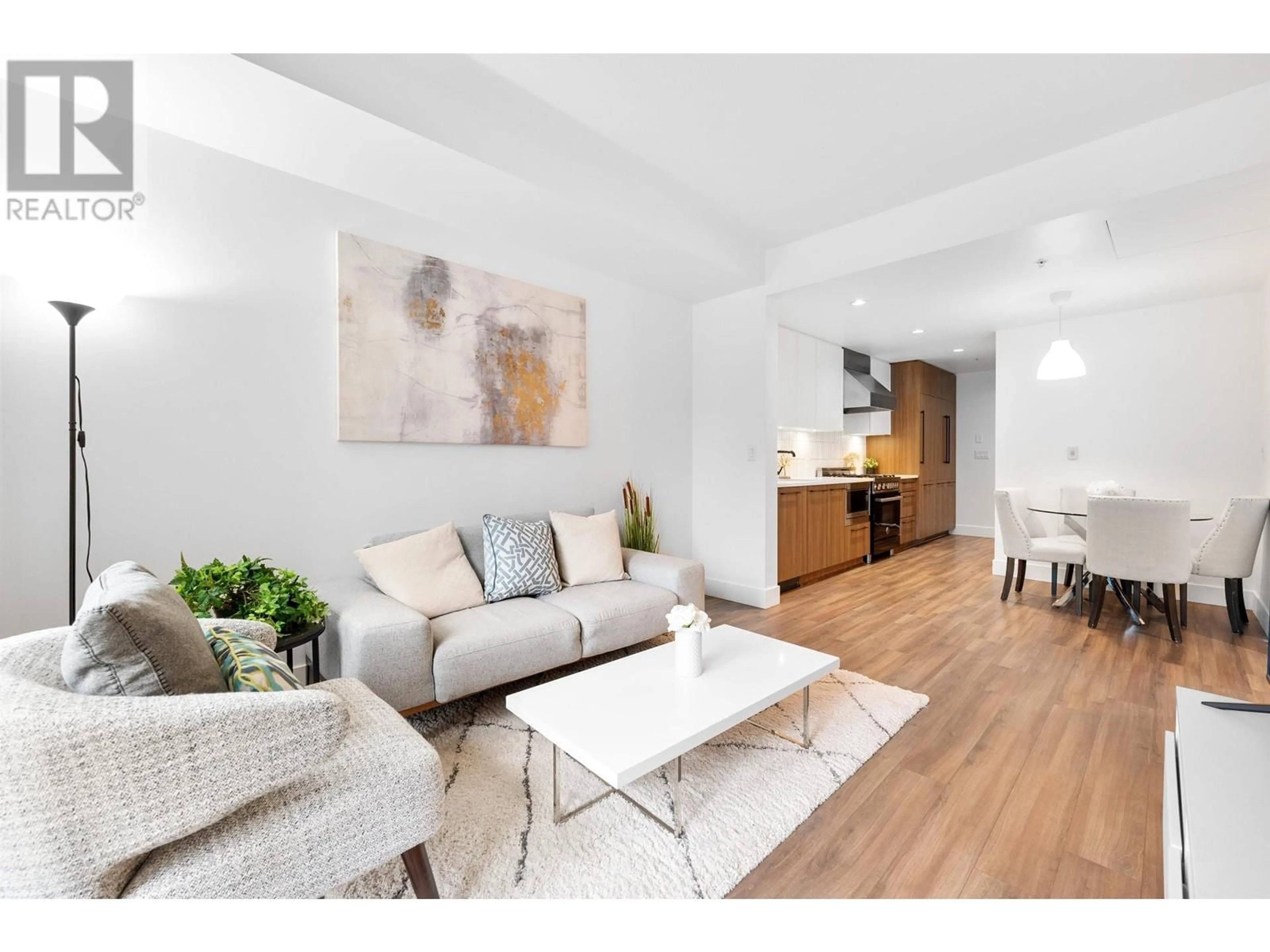 Living room with furniture, wood/laminate floor for 107 6933 CAMBIE STREET, Vancouver British Columbia V6P0J1