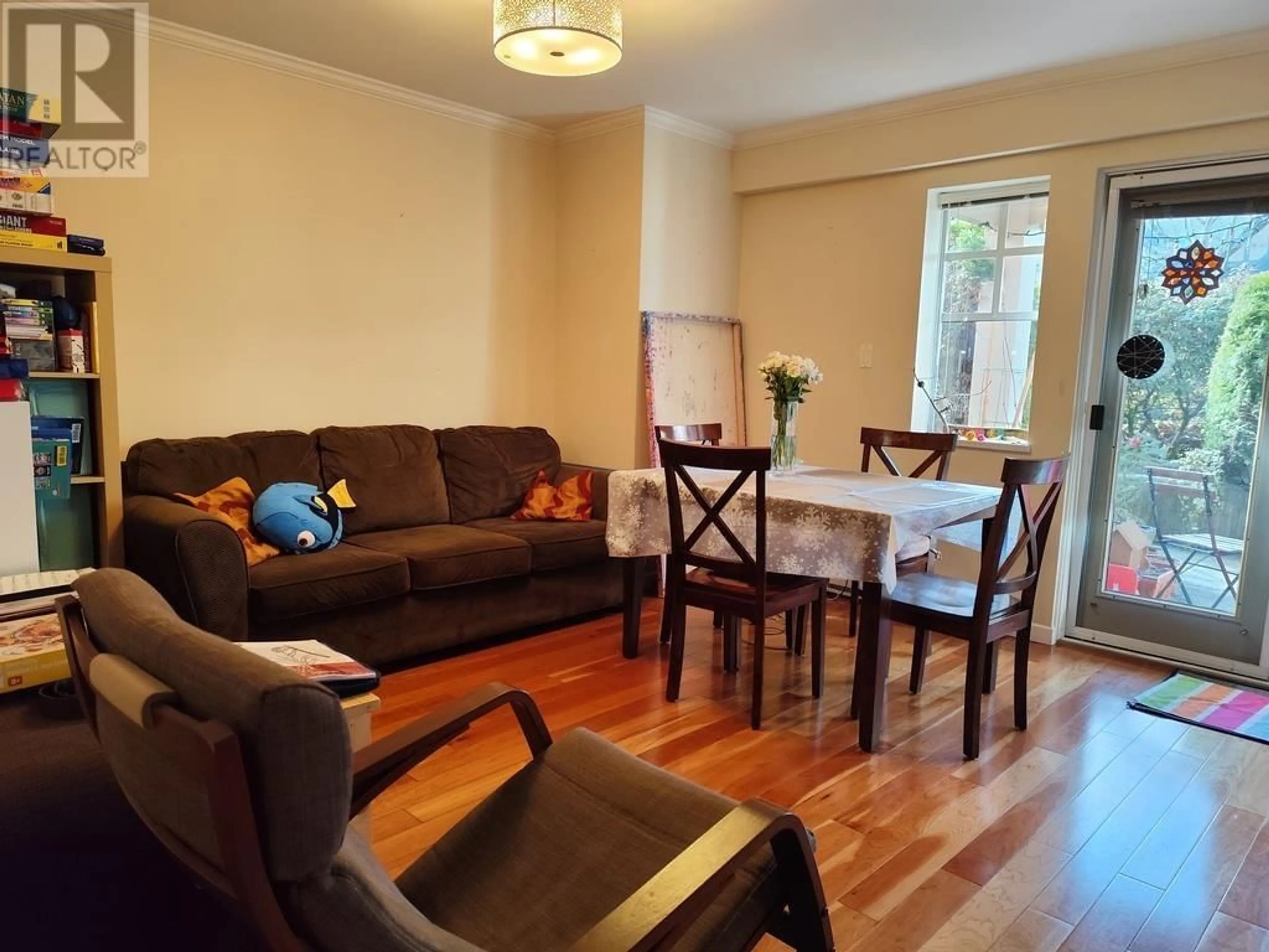 Living room with furniture, wood/laminate floor for 104 - 5880 HAMPTON PLACE, Vancouver British Columbia V6T2E9