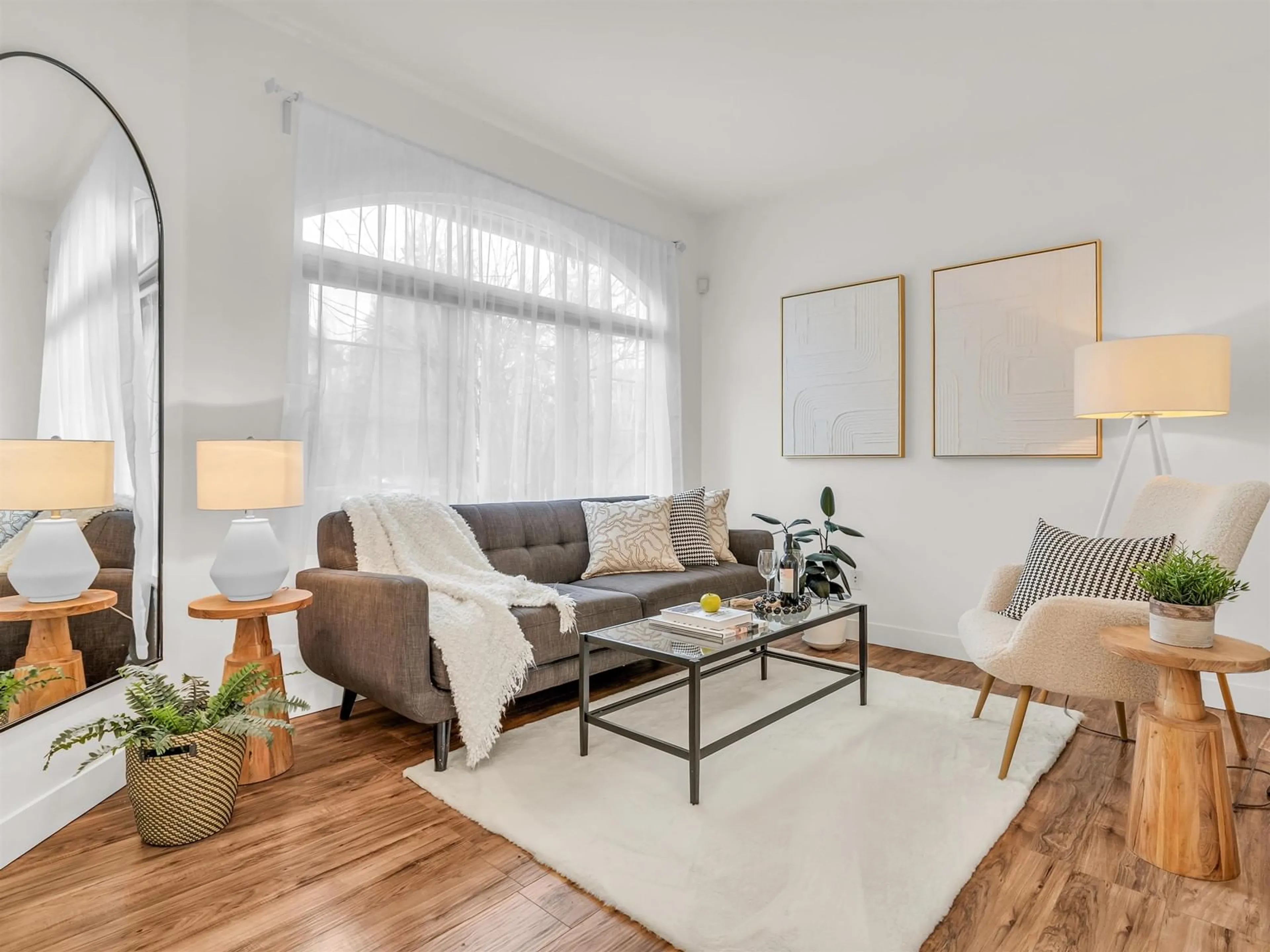 Living room with furniture, wood/laminate floor for 8694 206B STREET, Langley British Columbia V1M3X5