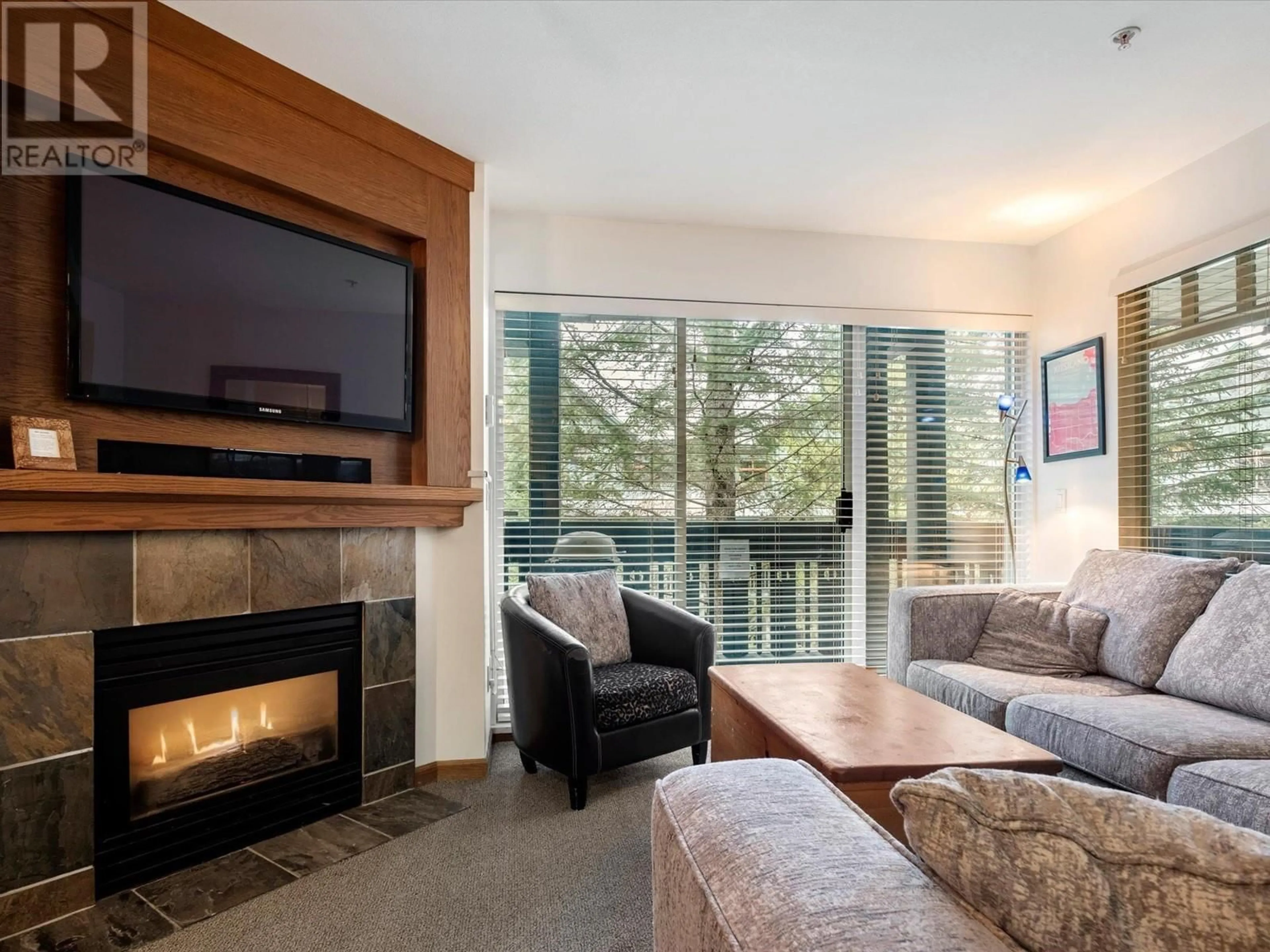 Living room with furniture, wood/laminate floor for 58 4335 NORTHLANDS BOULEVARD, Whistler British Columbia V8E1A9