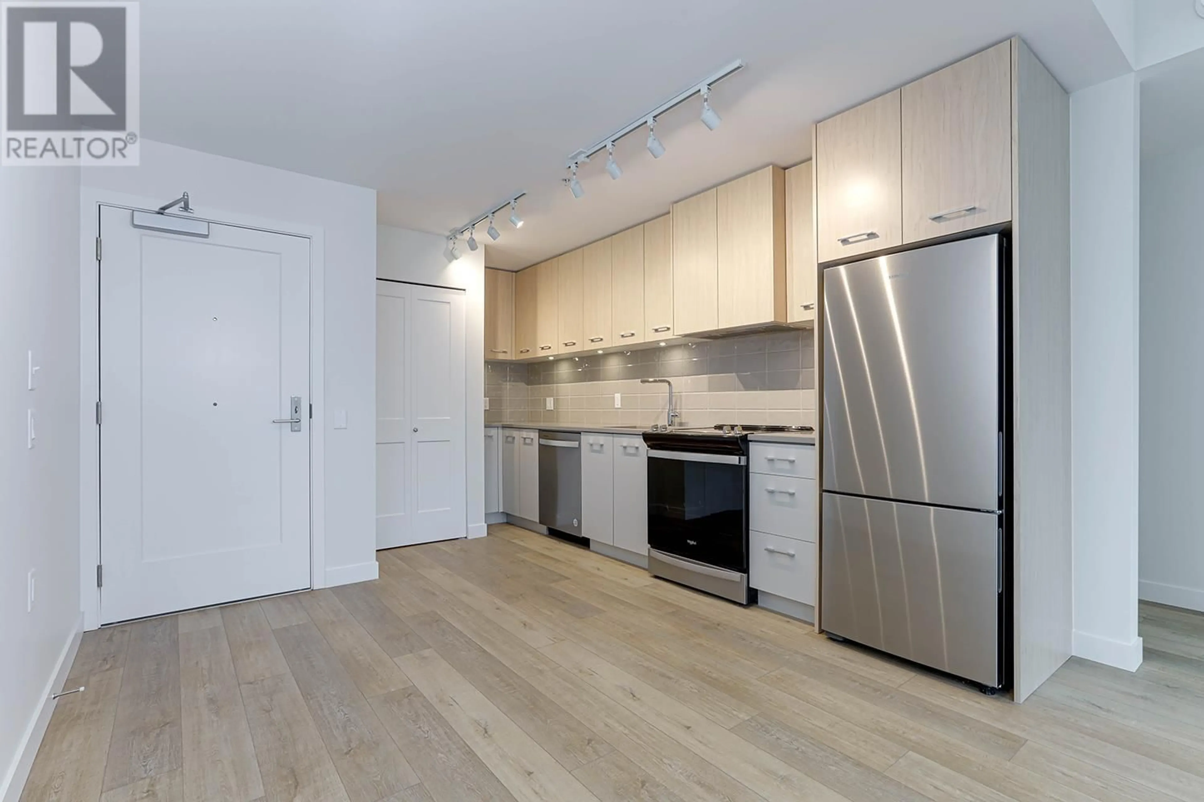 Standard kitchen, wood/laminate floor for 111 4933 CLARENDON STREET, Vancouver British Columbia V5R3J3