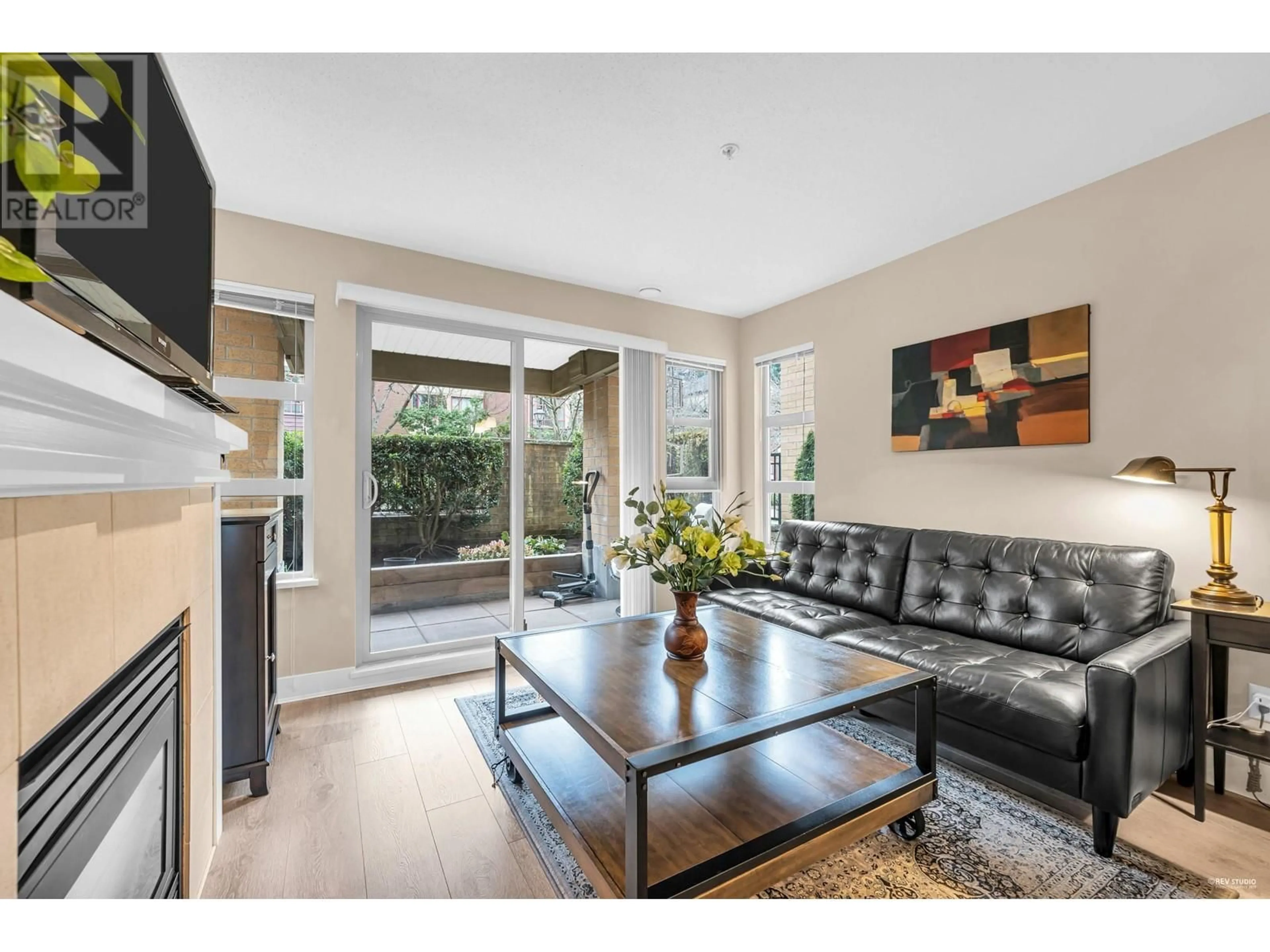Living room with furniture, wood/laminate floor for 119 - 5725 AGRONOMY ROAD, Vancouver British Columbia V6T1L9
