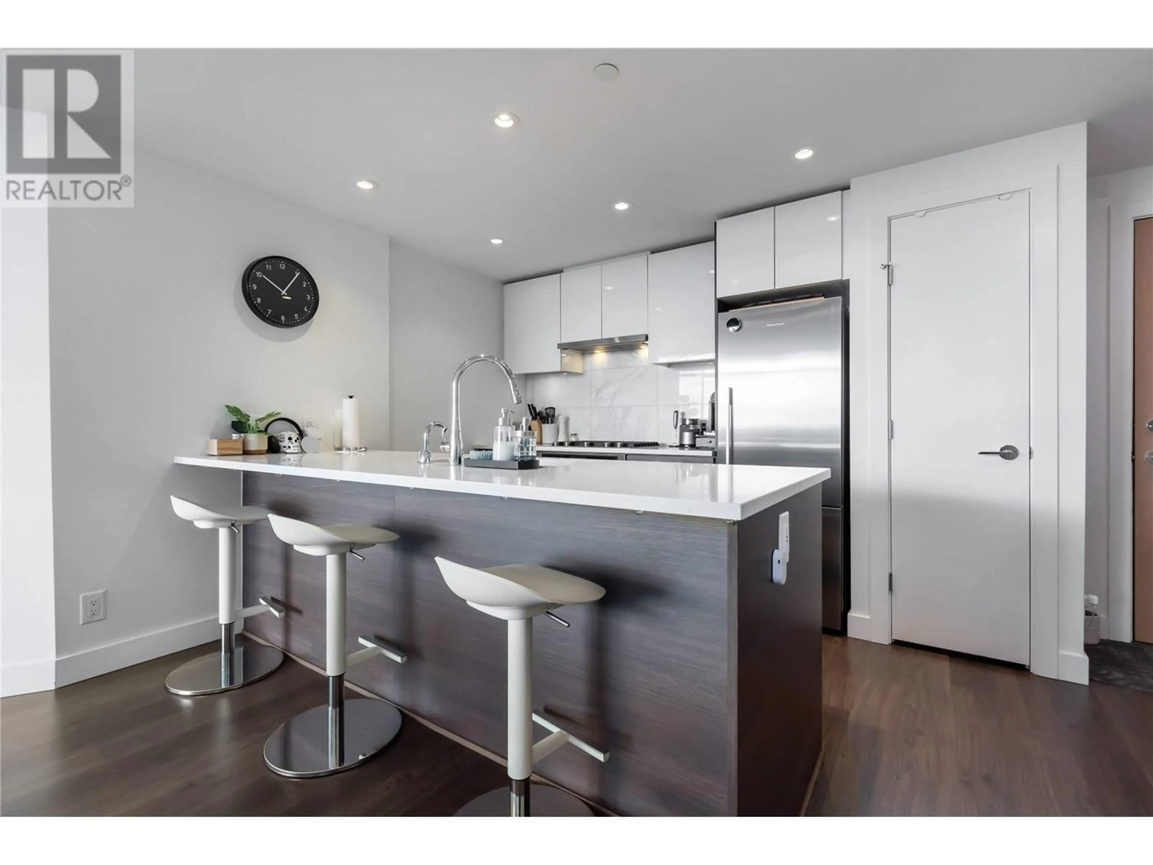 Open concept kitchen, wood/laminate floor for 910 - 3557 SAWMILL CRESCENT, Vancouver British Columbia V5S0E2