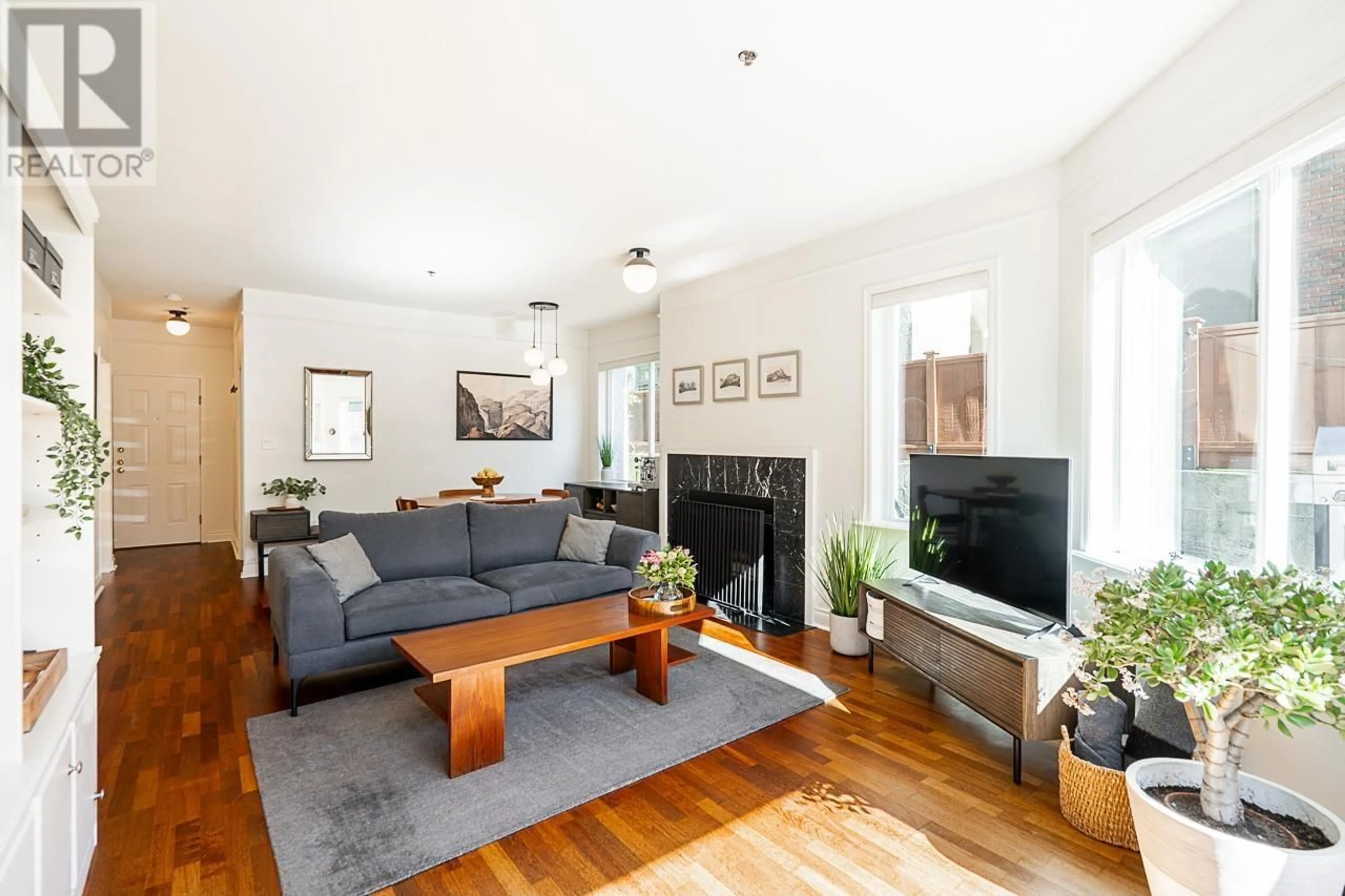 Living room with furniture, wood/laminate floor for 102 1265 W 11TH AVENUE, Vancouver British Columbia V6H1K6