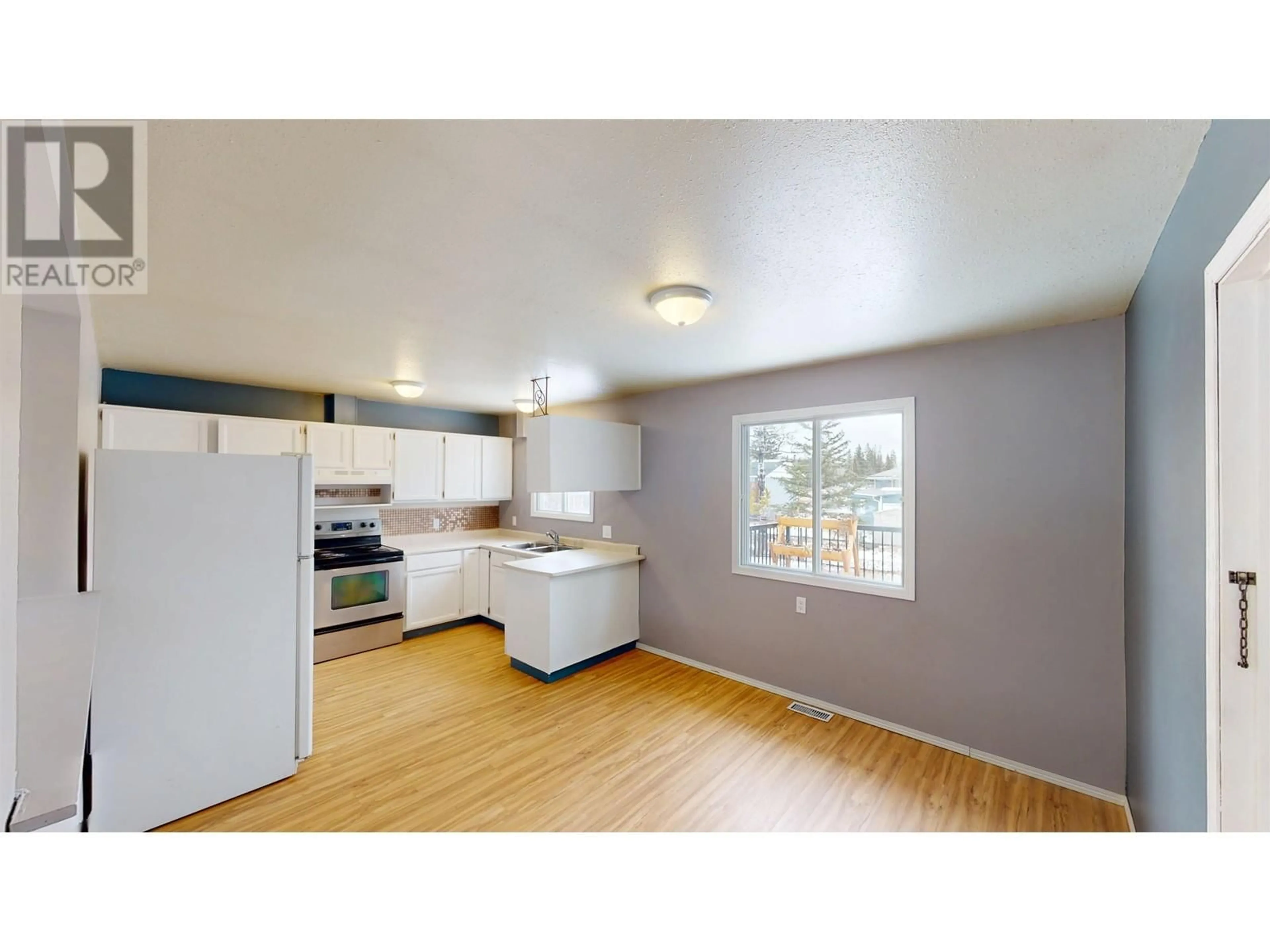 Standard kitchen, wood/laminate floor for 10109 MACINTOSH CRESCENT, Hudsons Hope British Columbia V0C1V0
