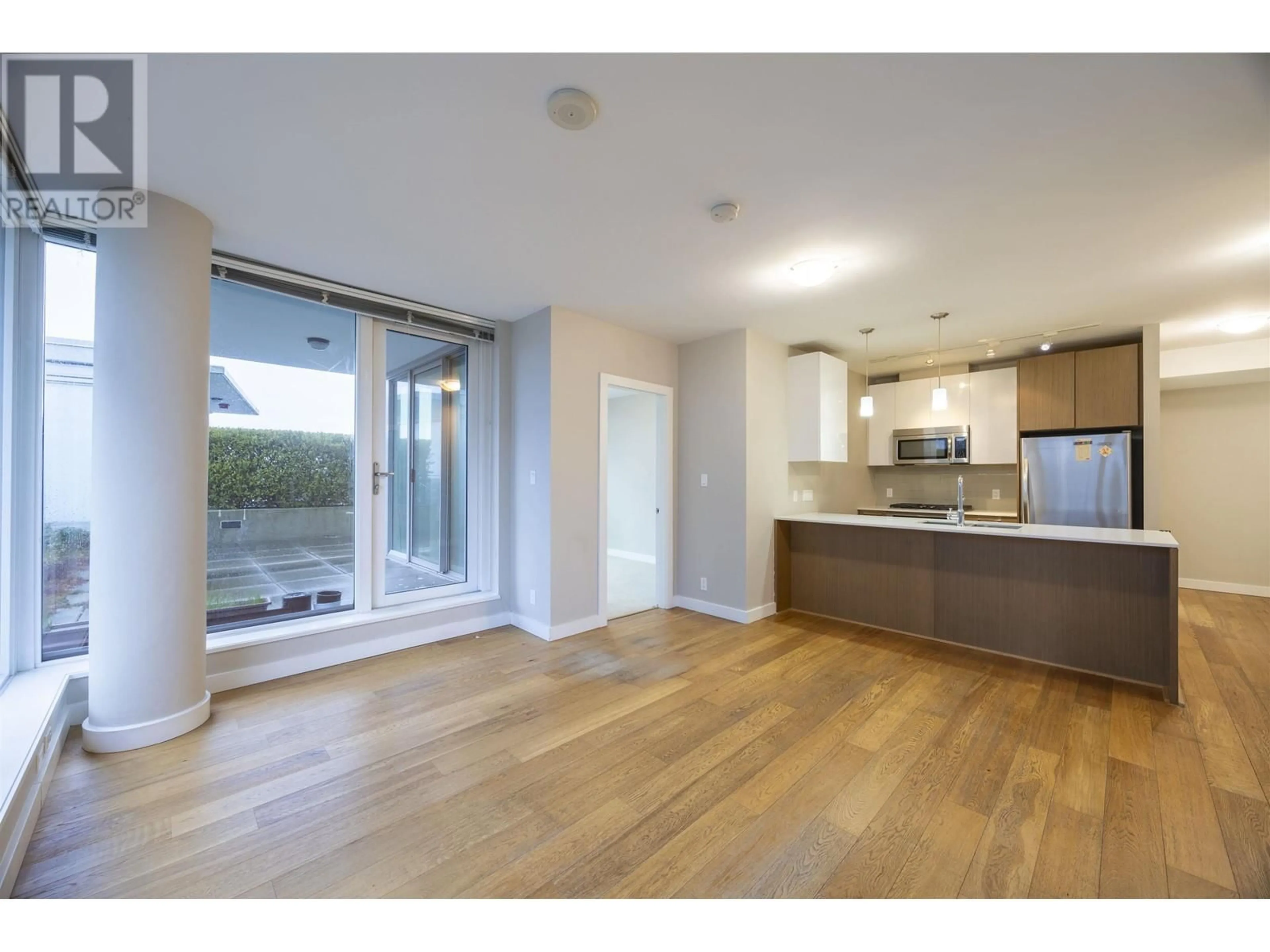 Open concept kitchen, wood/laminate floor for 702 - 6951 ELMBRIDGE WAY, Richmond British Columbia V7C0A4