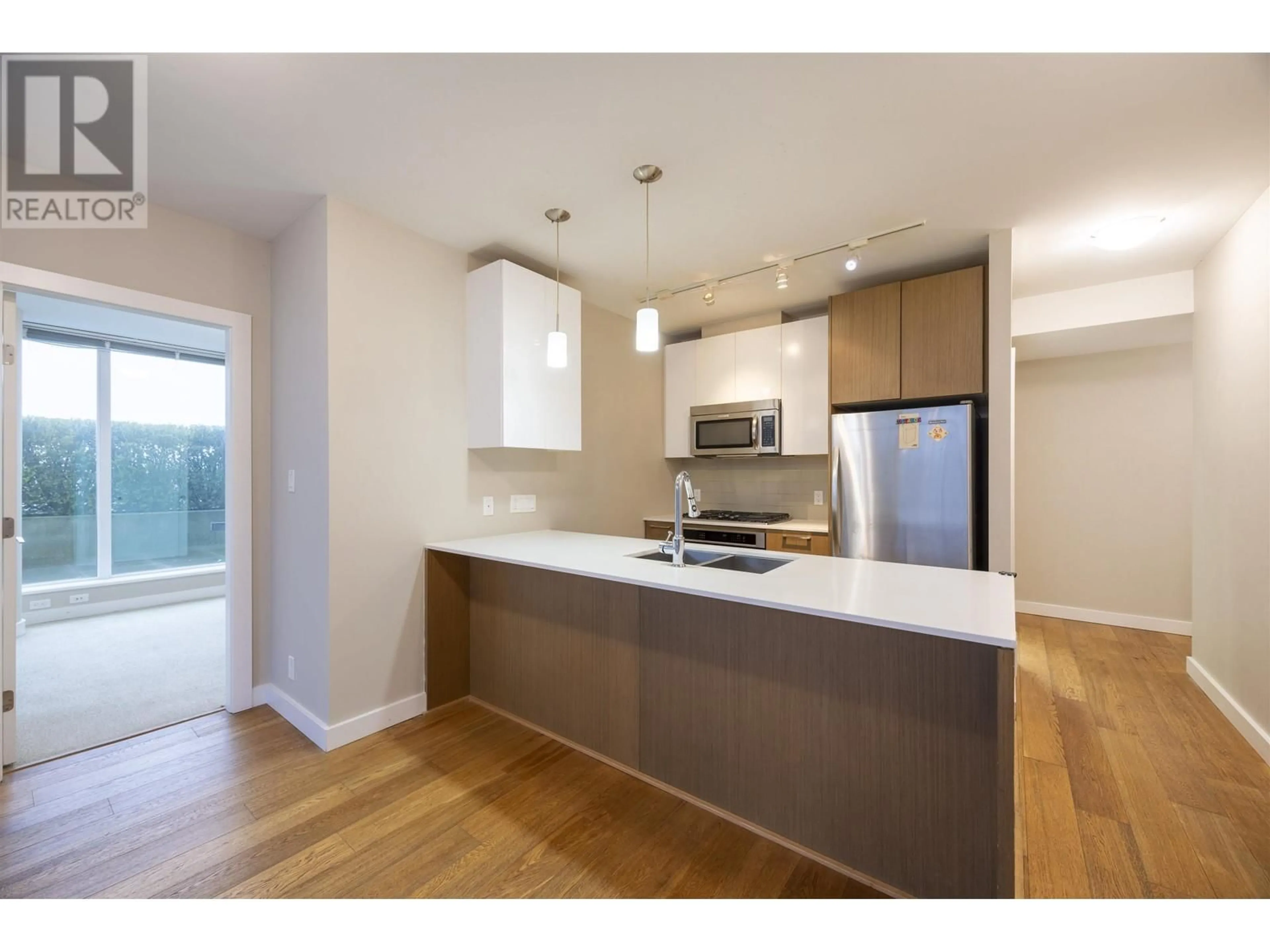 Open concept kitchen, wood/laminate floor for 702 - 6951 ELMBRIDGE WAY, Richmond British Columbia V7C0A4