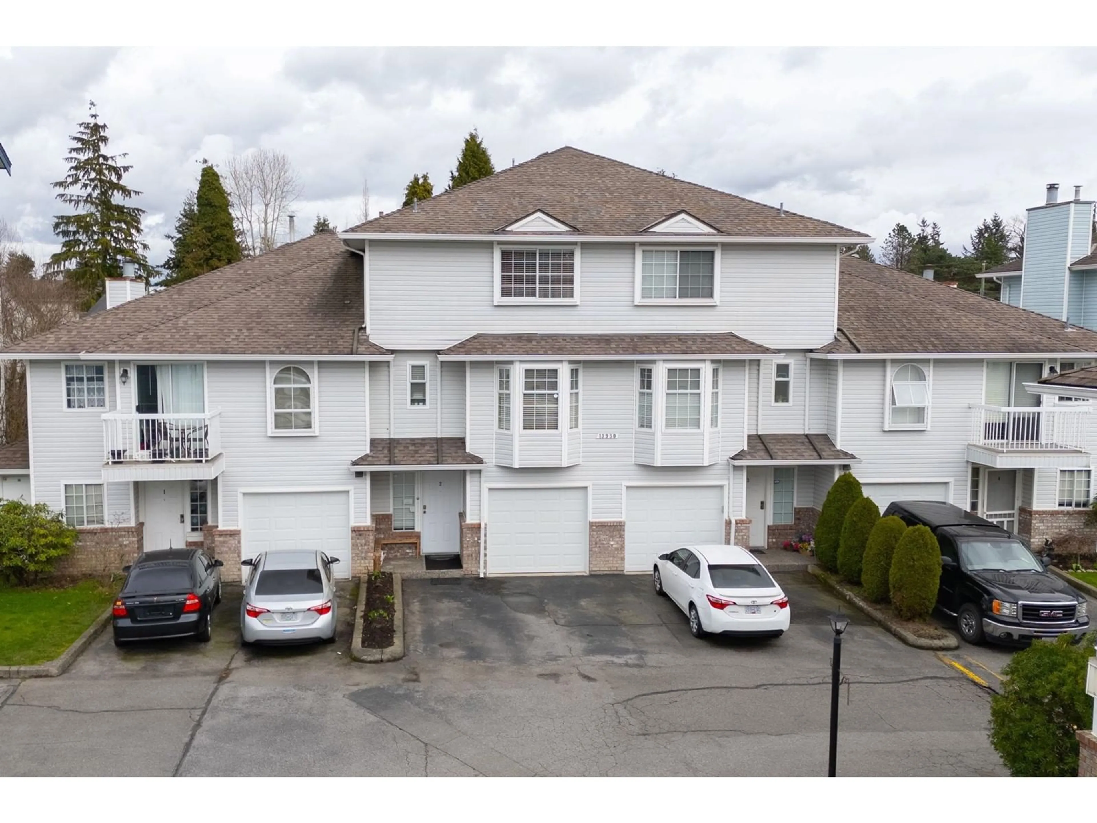 A pic from outside/outdoor area/front of a property/back of a property/a pic from drone, unknown for 2 13930 72 AVENUE, Surrey British Columbia V3W0J8