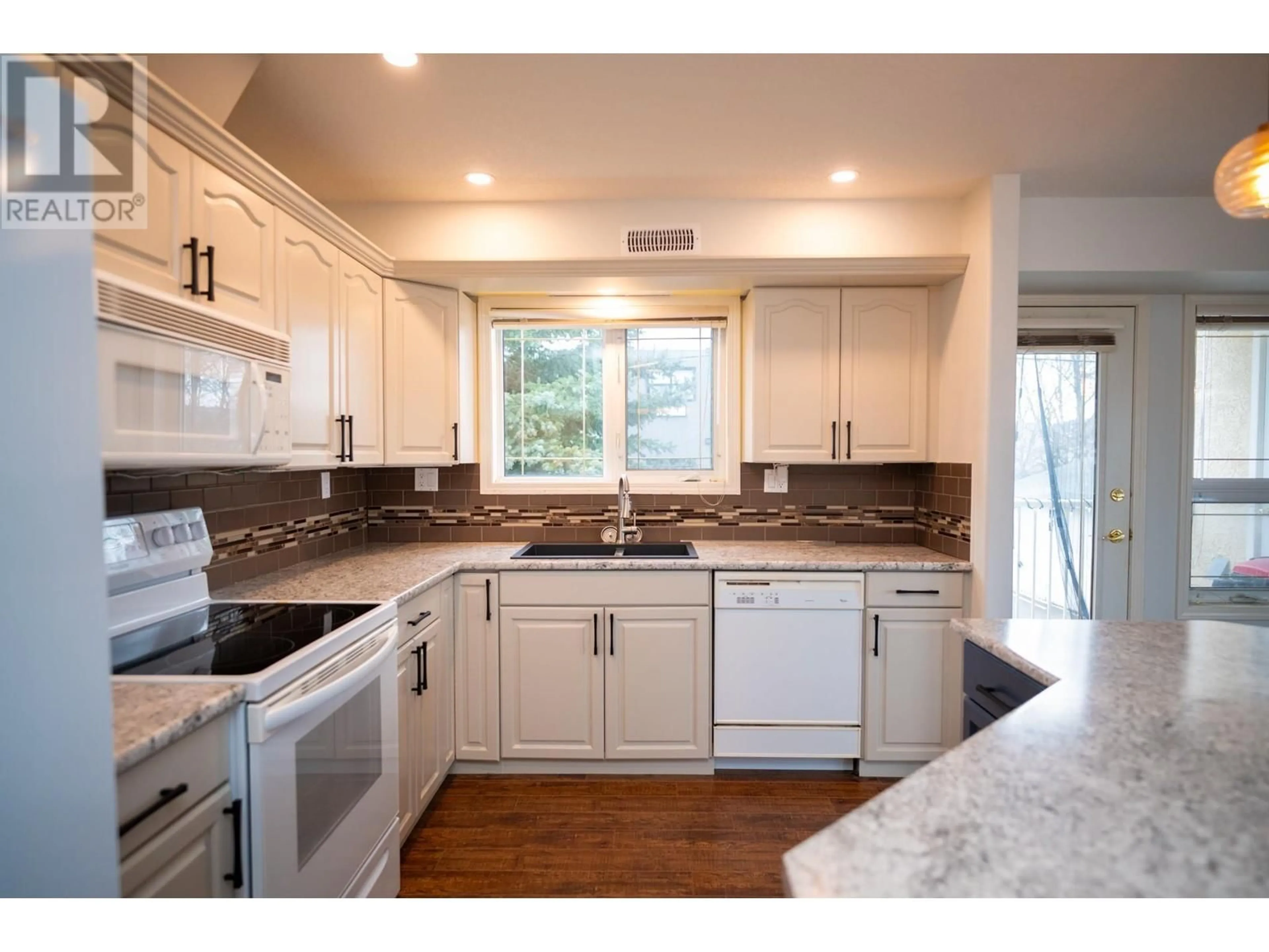 Open concept kitchen, unknown for 106 1693 6TH AVENUE, Prince George British Columbia V2L3N5