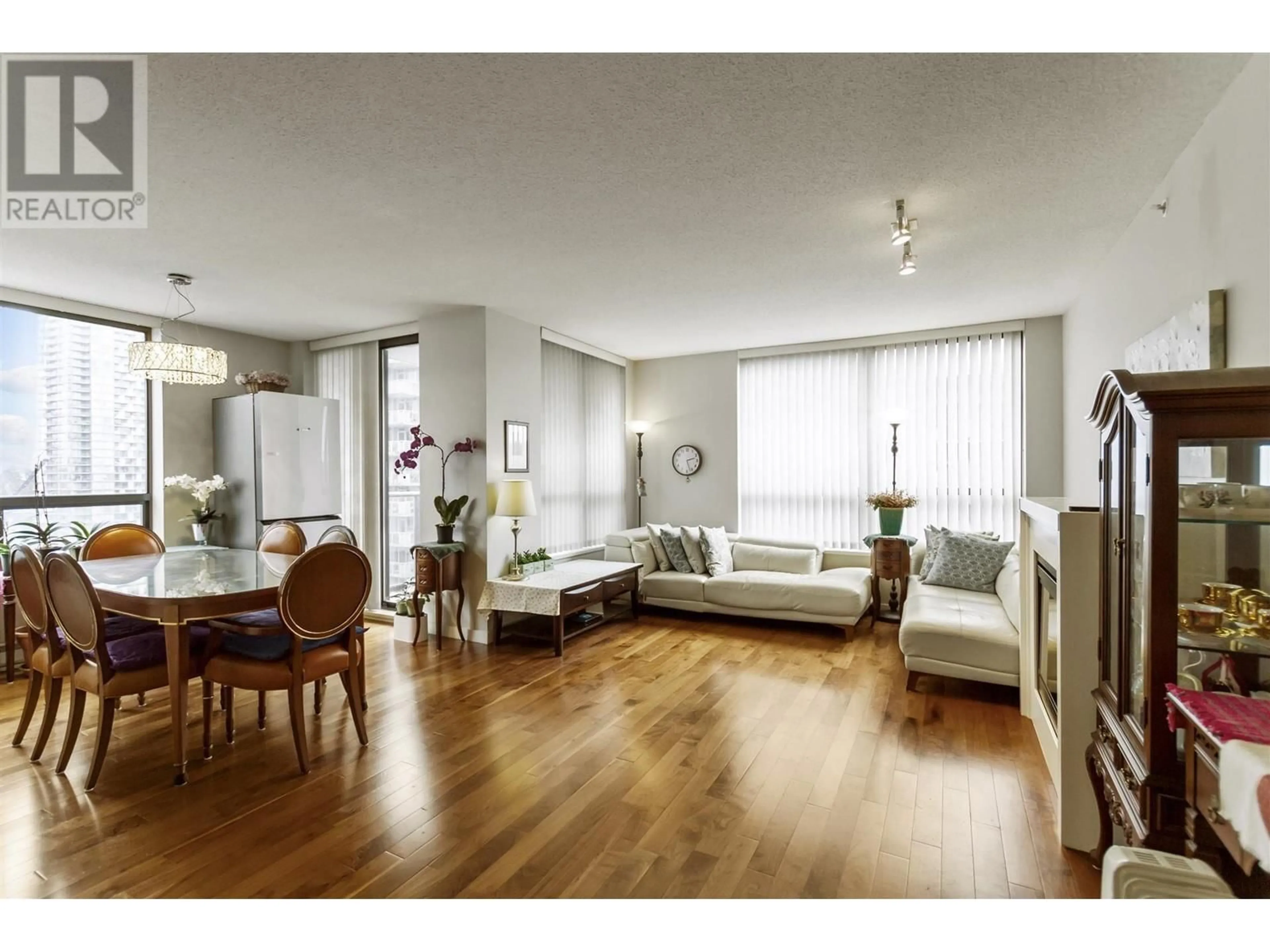 Living room with furniture, wood/laminate floor for 2003 2979 GLEN DRIVE, Coquitlam British Columbia V3B0B2