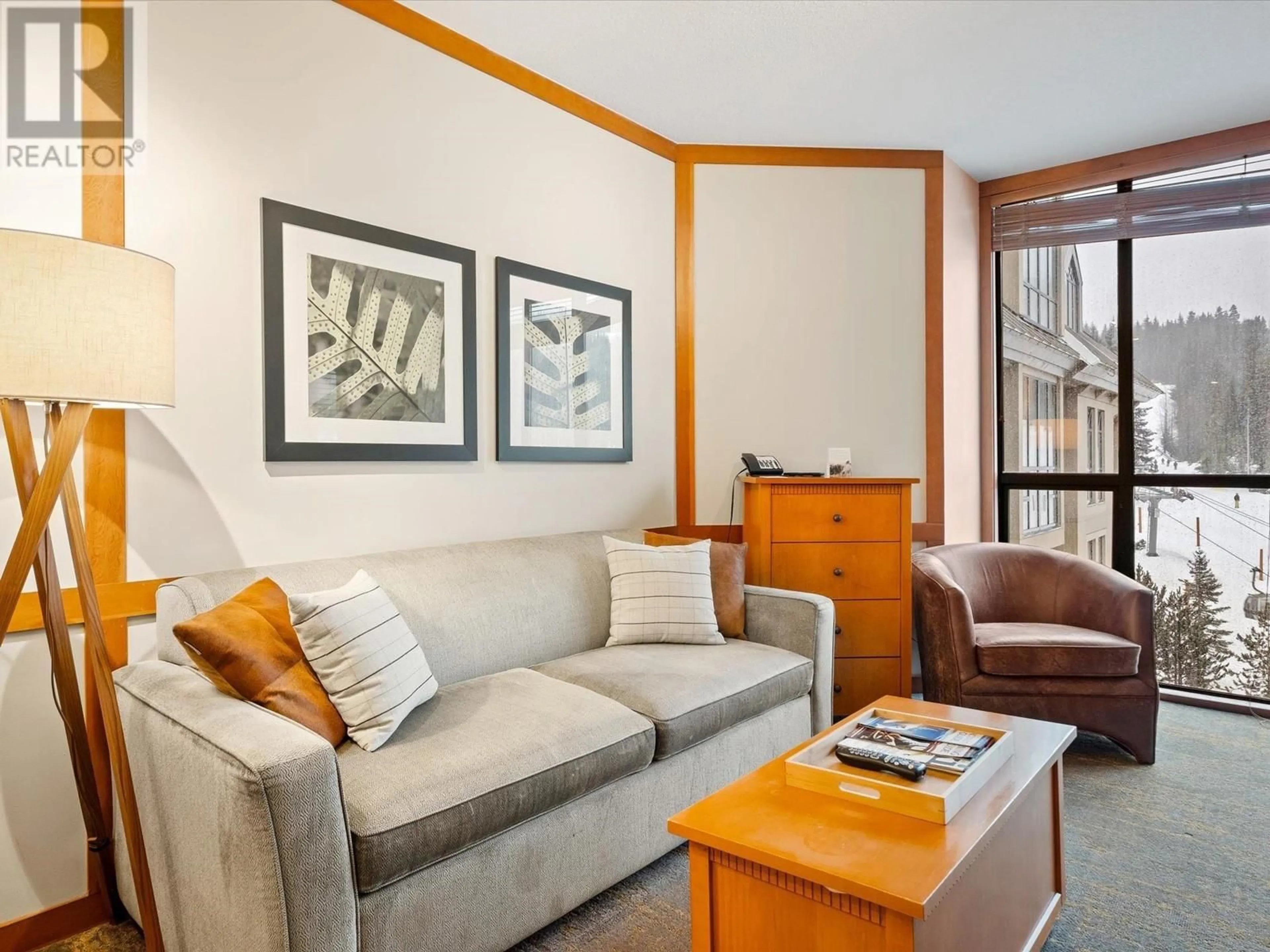 Living room with furniture, wood/laminate floor for 602 4320 SUNDIAL CRESCENT, Whistler British Columbia V8E1G6