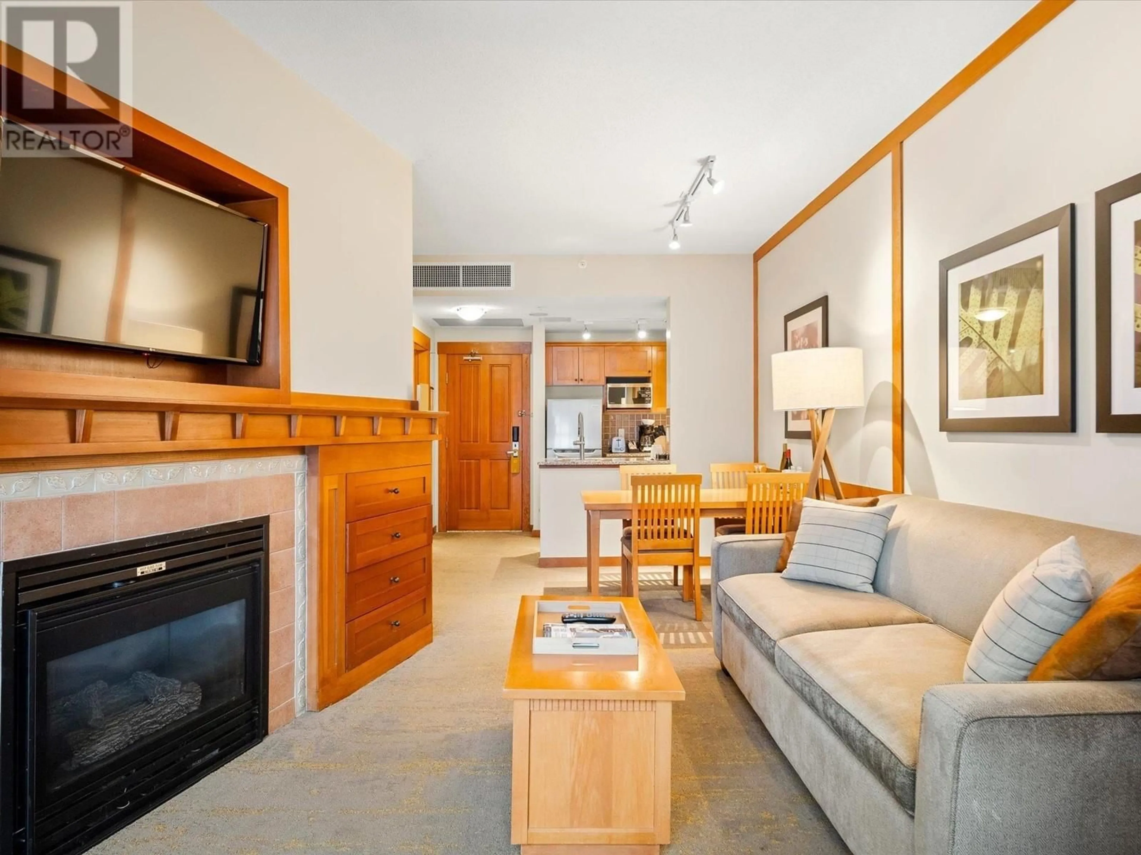 Living room with furniture, wood/laminate floor for 602 4320 SUNDIAL CRESCENT, Whistler British Columbia V8E1G6