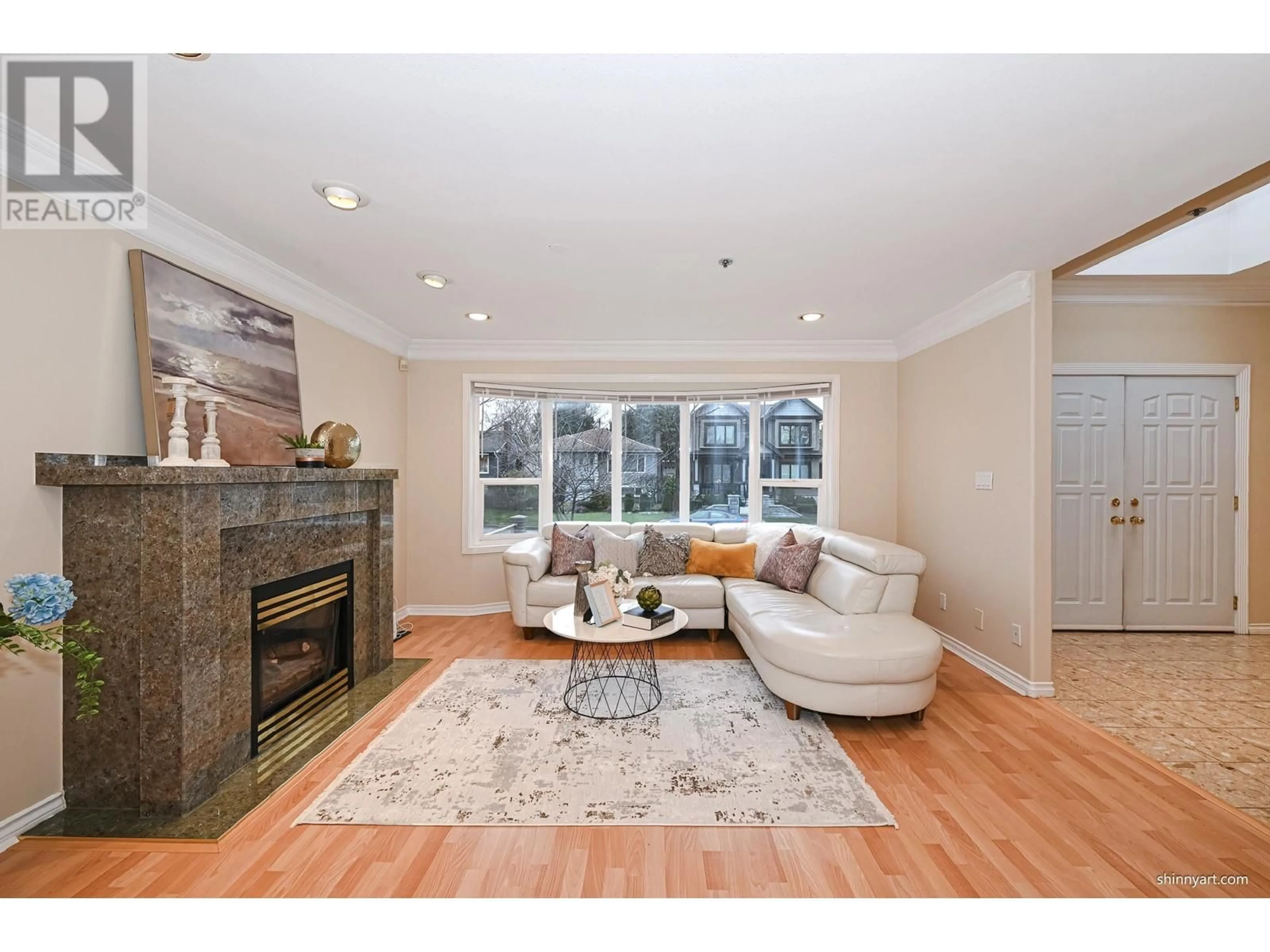 Living room with furniture, wood/laminate floor for 6813 INVERNESS STREET, Vancouver British Columbia V5X4G3