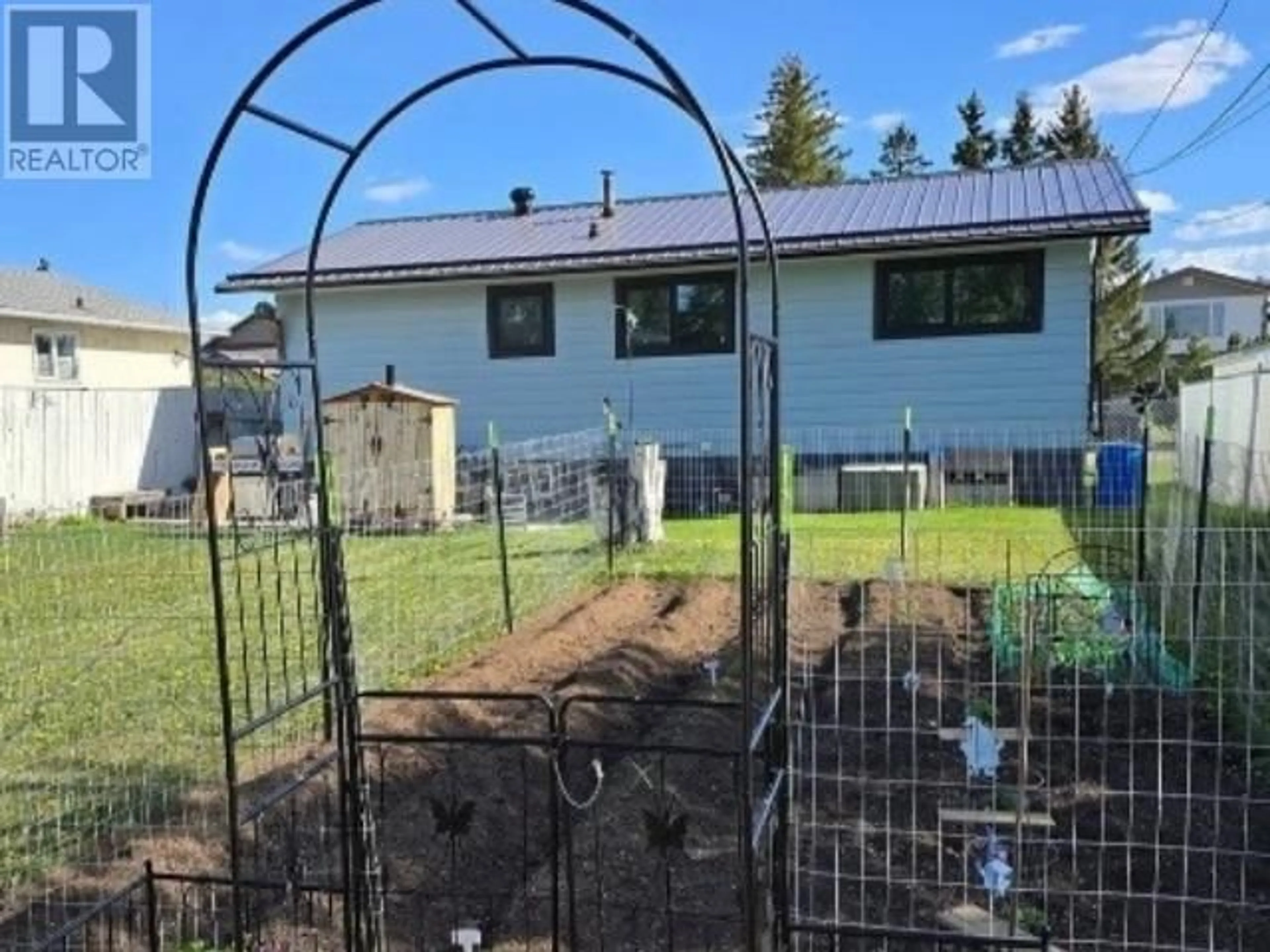 A pic from outside/outdoor area/front of a property/back of a property/a pic from drone, building for 8140 98 AVENUE, Fort St. John British Columbia V1J1P3