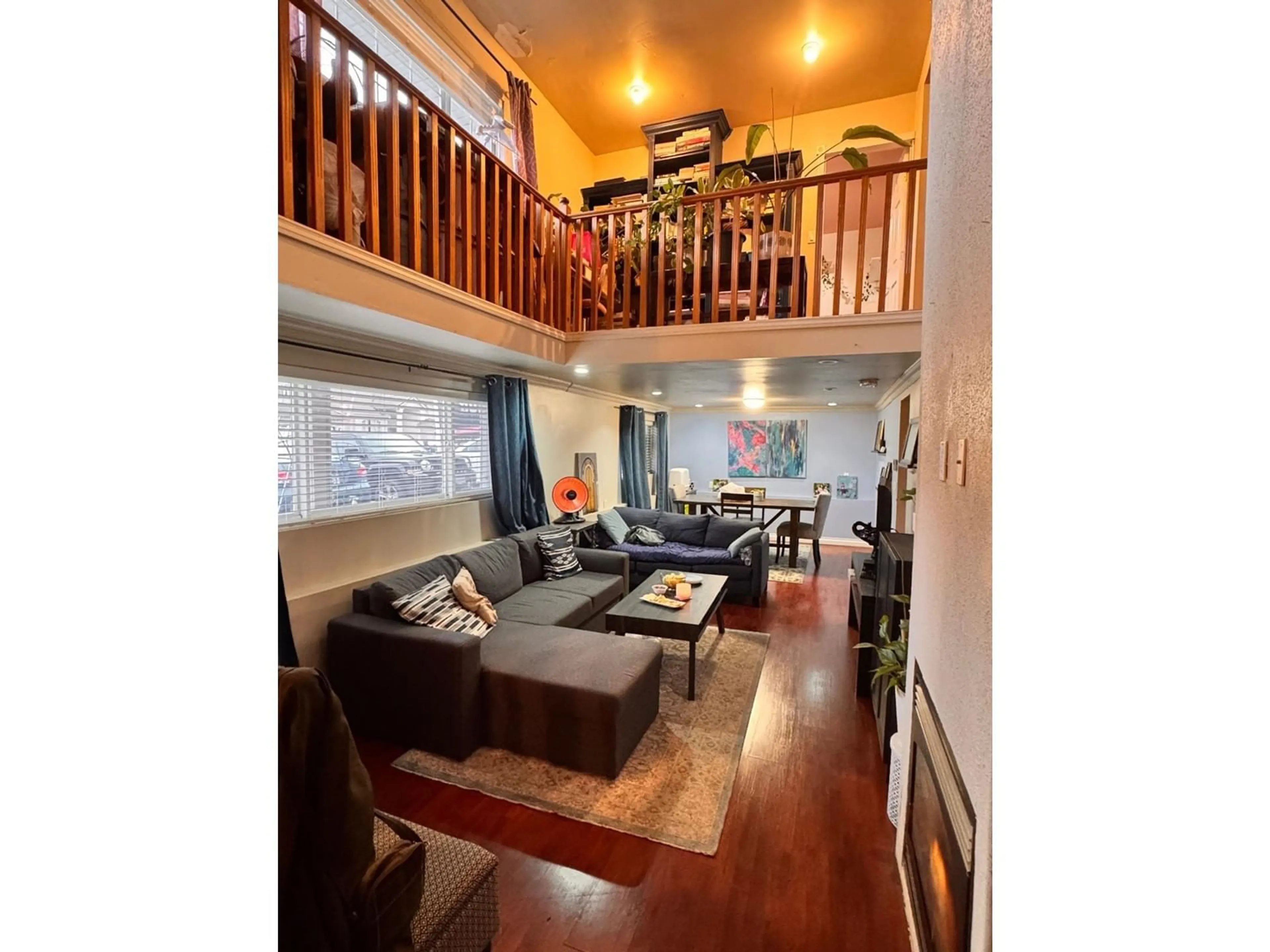 Living room with furniture, wood/laminate floor for 7701 127 STREET, Surrey British Columbia V3W4B1