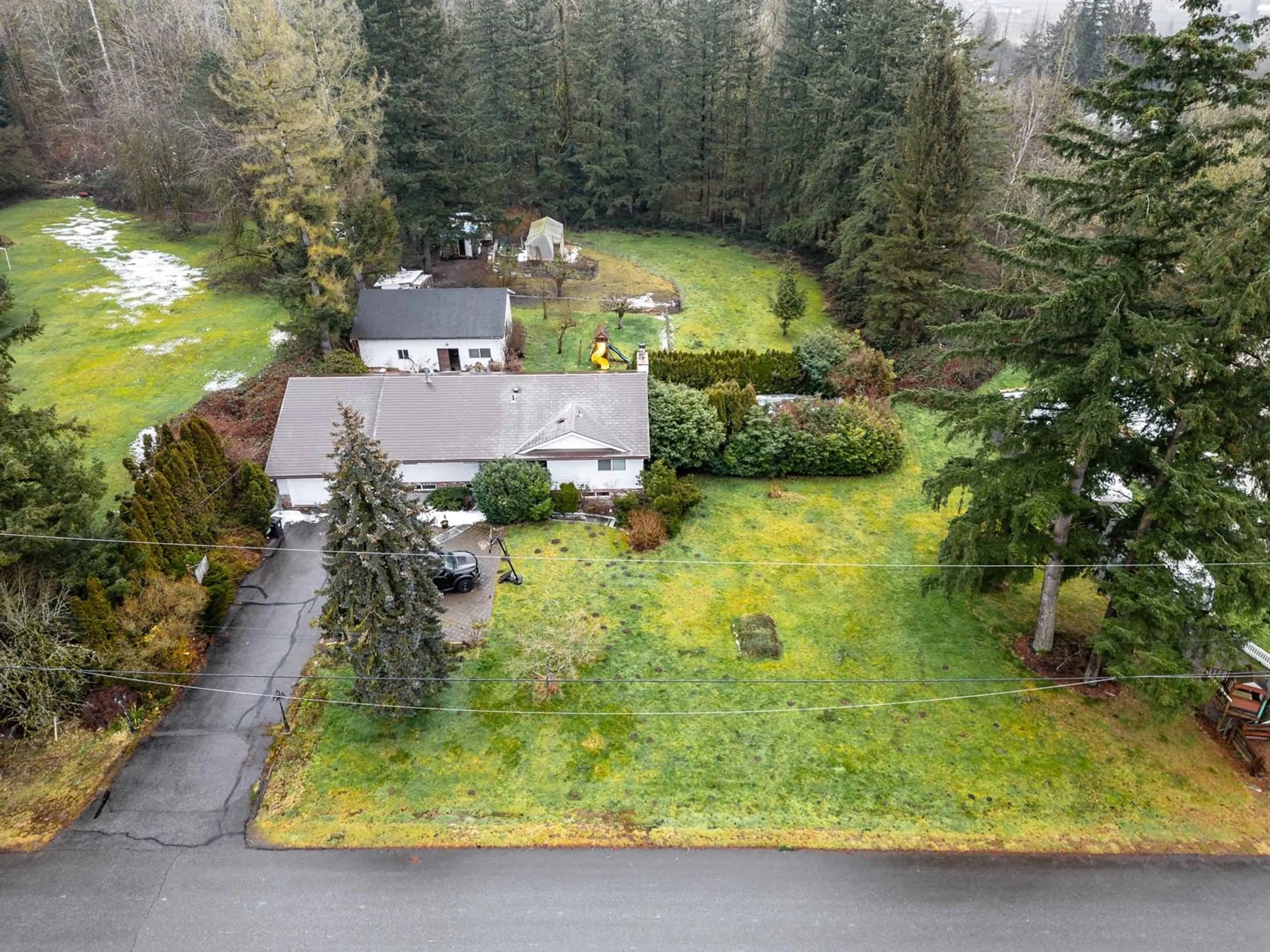 A pic from outside/outdoor area/front of a property/back of a property/a pic from drone, forest/trees view for 7334 209A, Langley British Columbia V2Y2E4