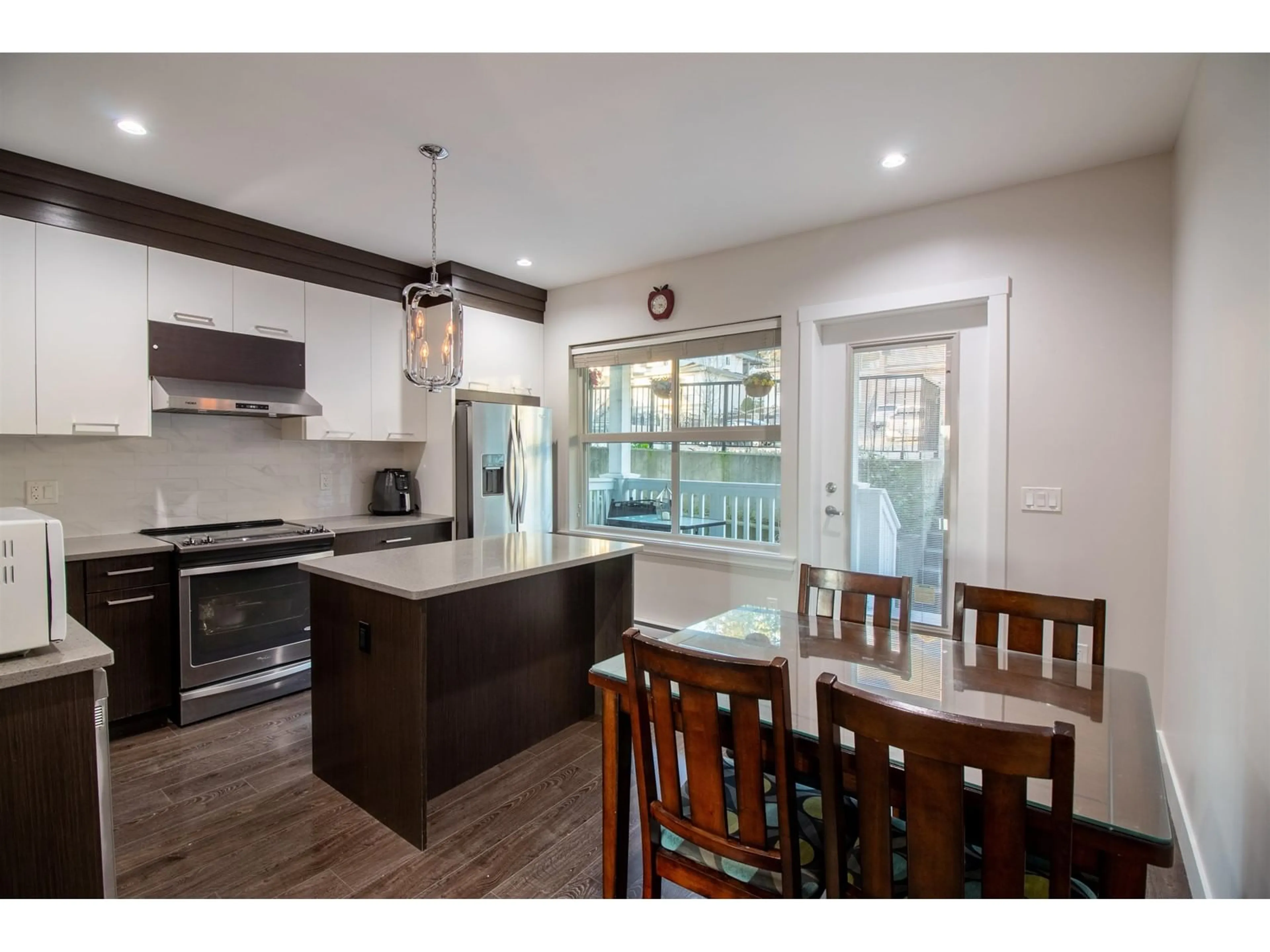 Open concept kitchen, wood/laminate floor for 2 14450 68 AVENUE, Surrey British Columbia V3S2A9