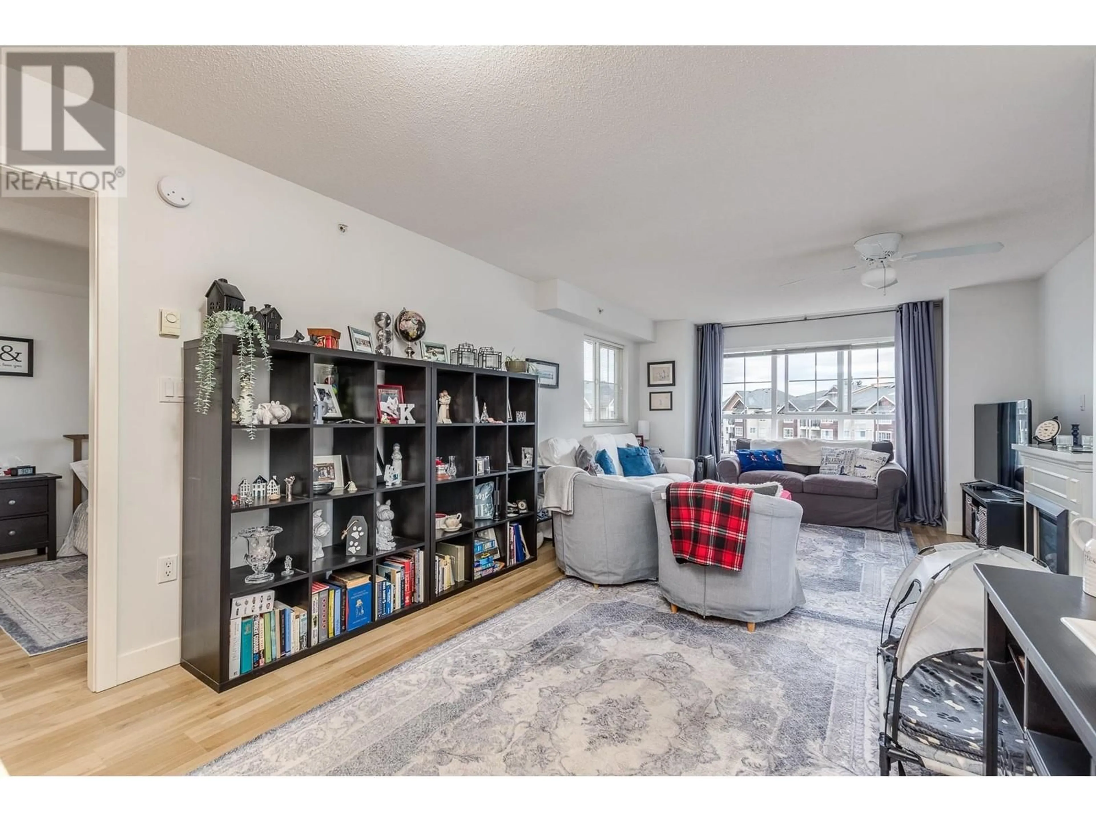 Living room with furniture, unknown for 407 - 19673 MEADOW GARDENS WAY, Pitt Meadows British Columbia V3Y0A1