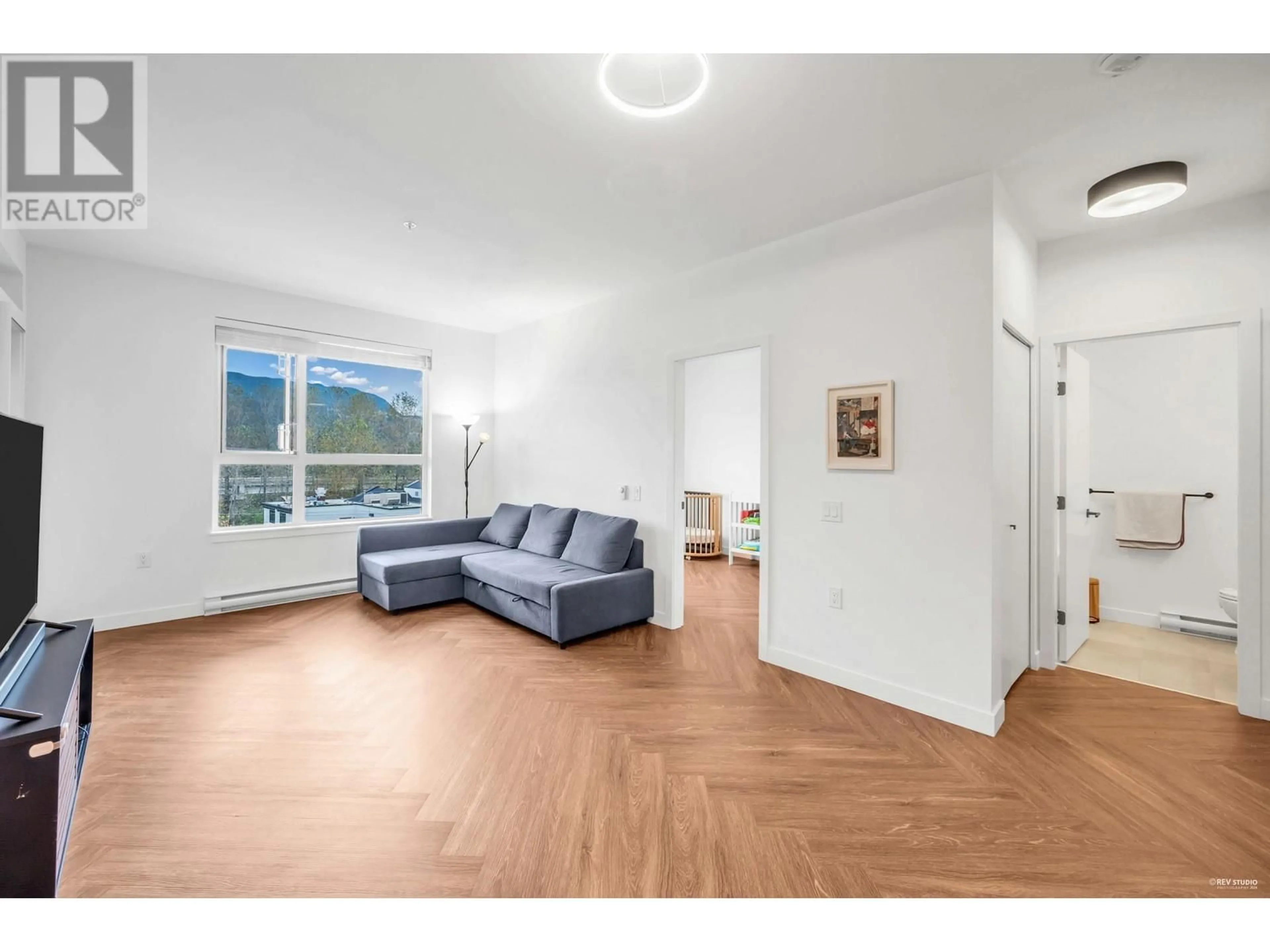 Living room with furniture, wood/laminate floor for 411 - 3229 ST JOHNS STREET, Port Moody British Columbia V3H0M4