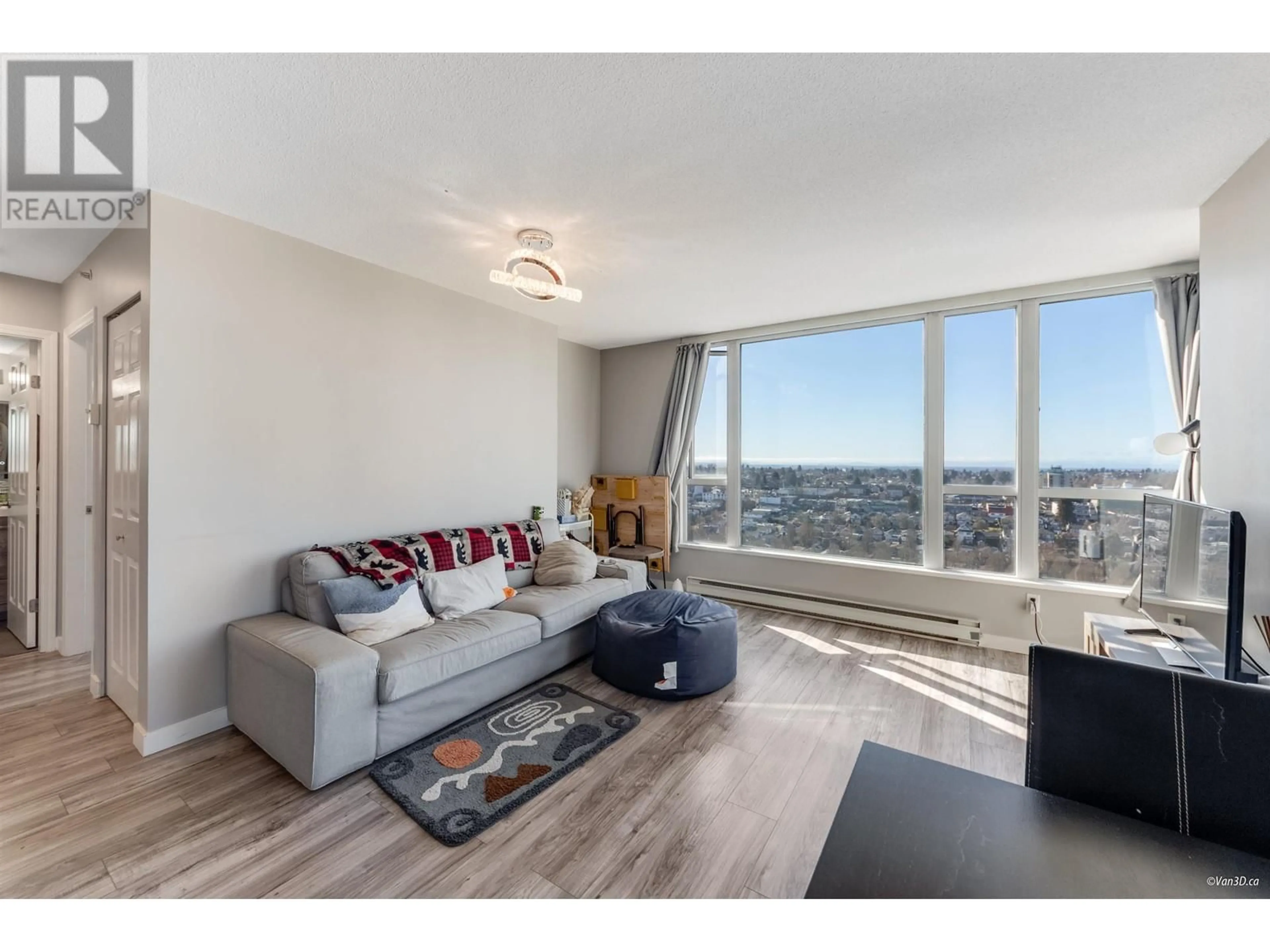 Living room with furniture, wood/laminate floor for 1904 5189 GASTON STREET, Vancouver British Columbia V5R6C7