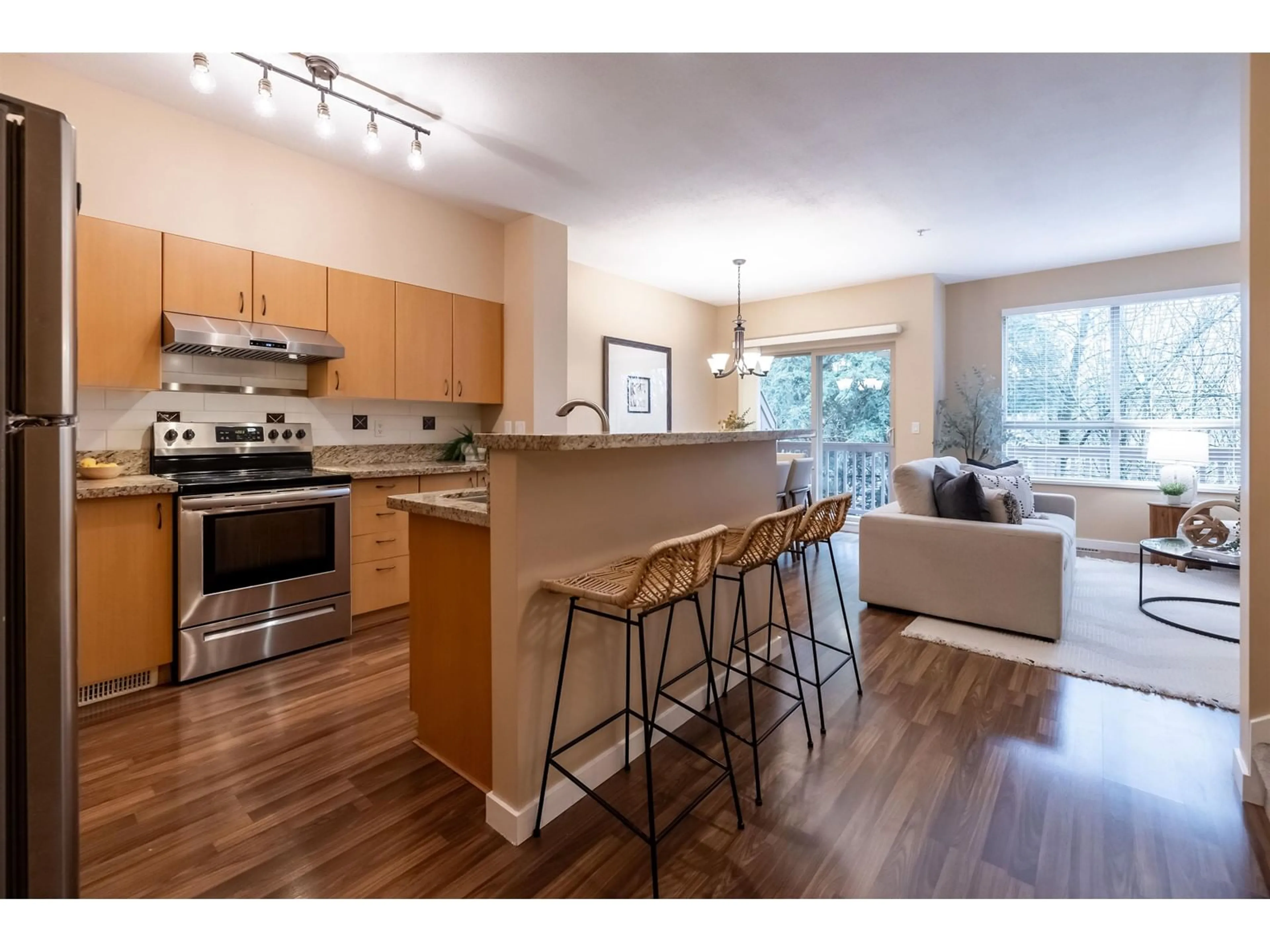 Open concept kitchen, wood/laminate floor for 3 20350 68 AVENUE, Langley British Columbia V2Y3A5