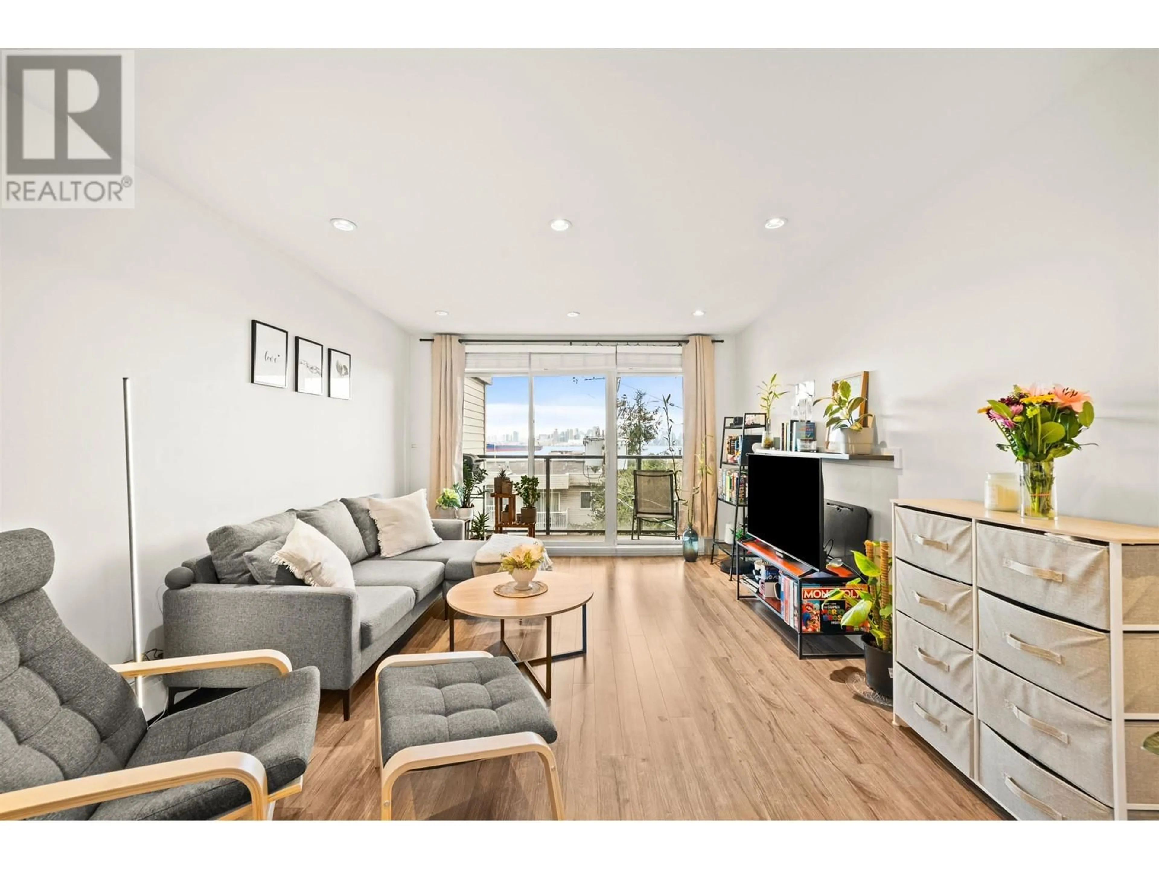 Living room with furniture, wood/laminate floor for 301 327 W 2ND STREET, North Vancouver British Columbia V7M1E2