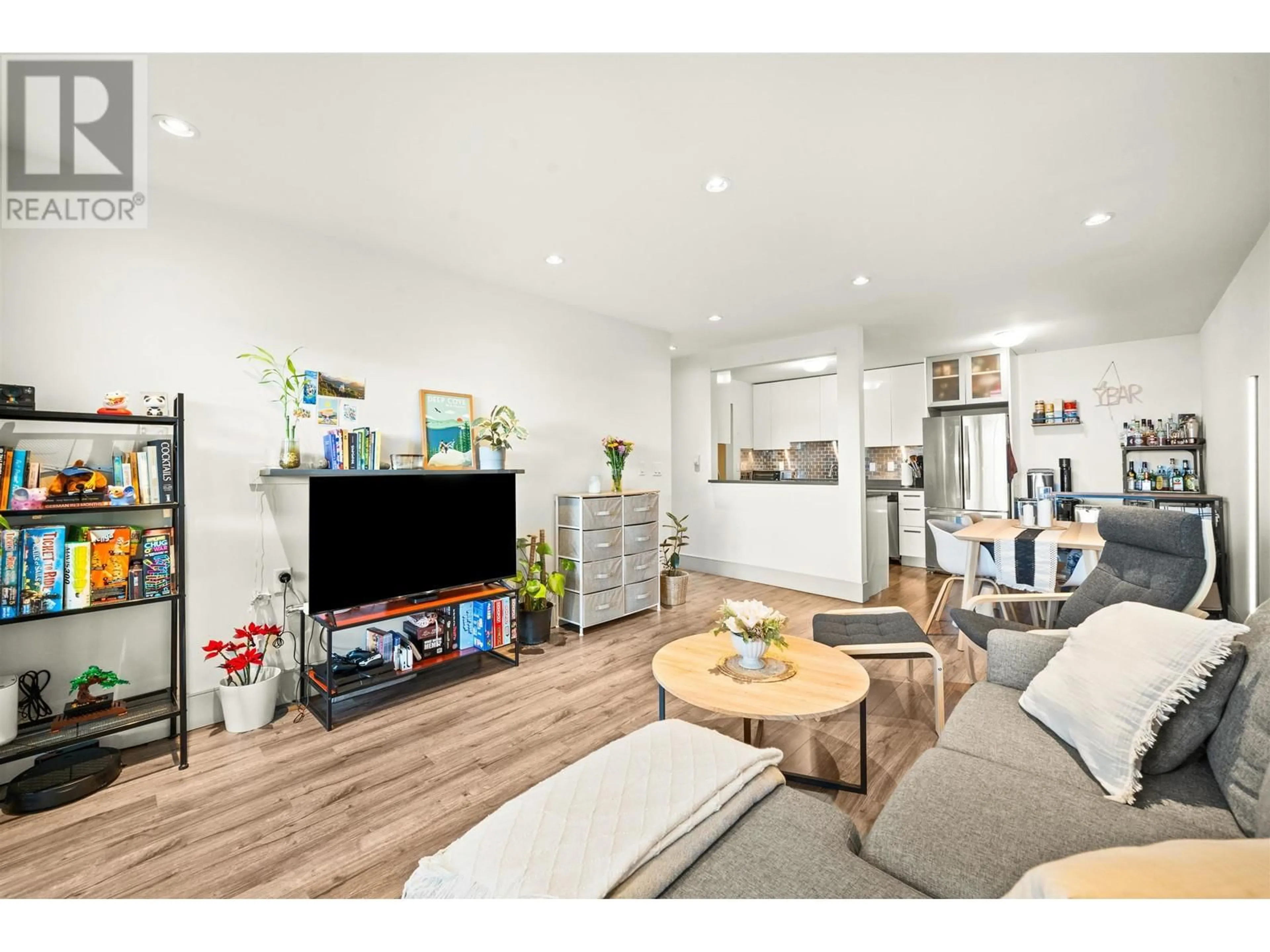 Living room with furniture, wood/laminate floor for 301 327 W 2ND STREET, North Vancouver British Columbia V7M1E2