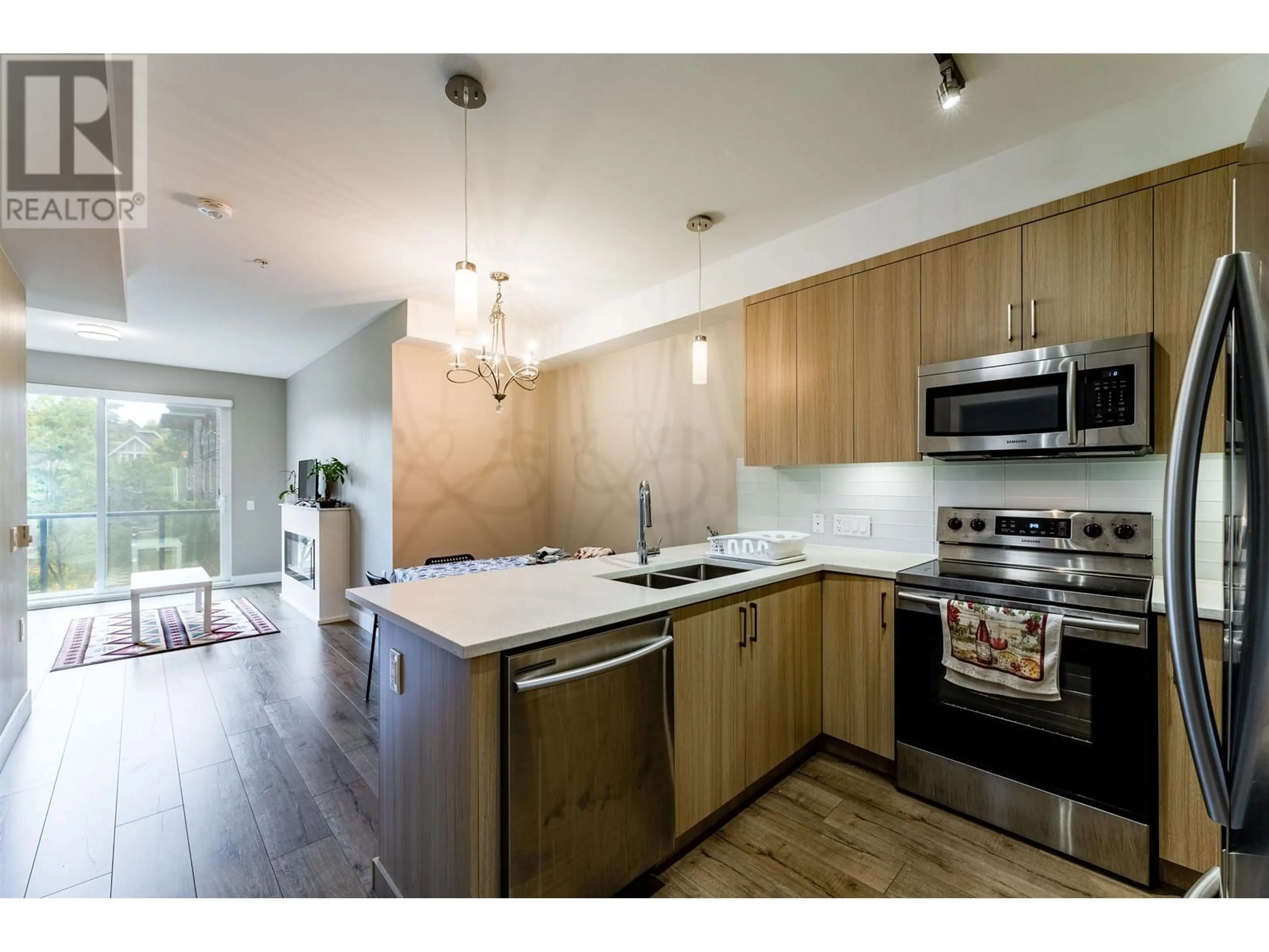 Open concept kitchen, wood/laminate floor for 215 12460 191 STREET, Pitt Meadows British Columbia V3Y2J2