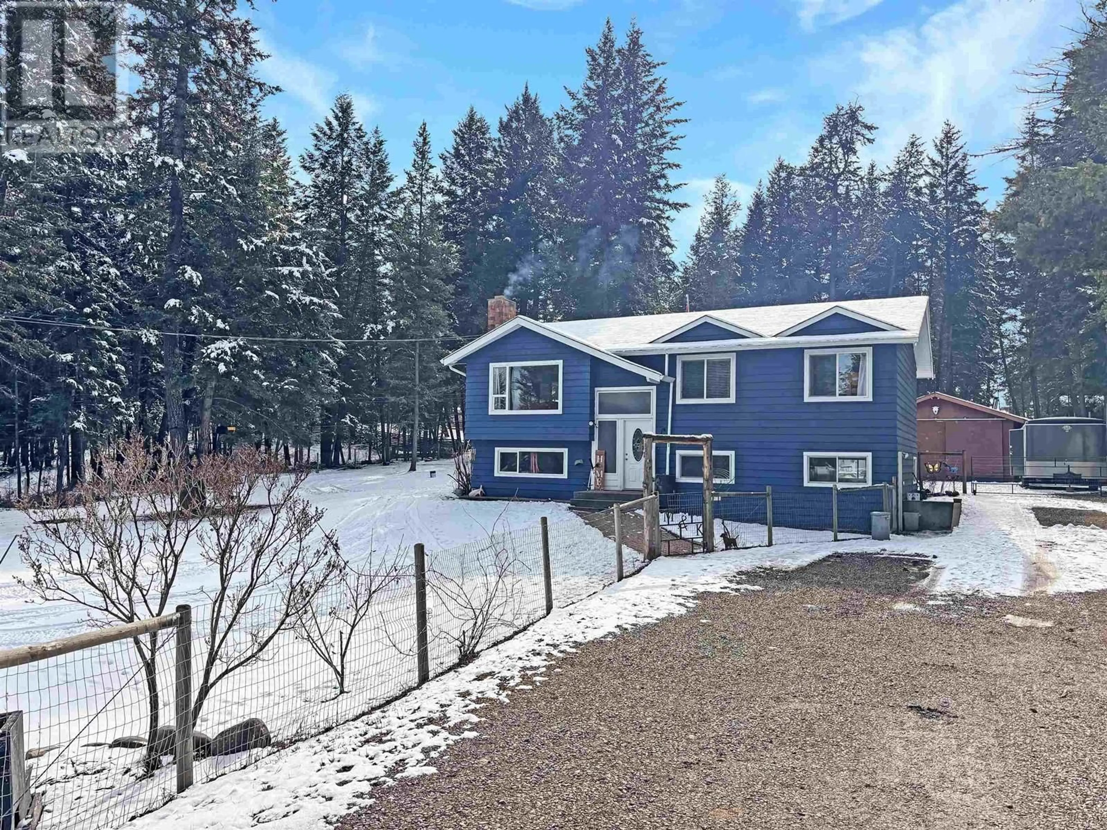 A pic from outside/outdoor area/front of a property/back of a property/a pic from drone, forest/trees view for 5047 EASZEE DRIVE, 108 Mile Ranch British Columbia V0K2Z0
