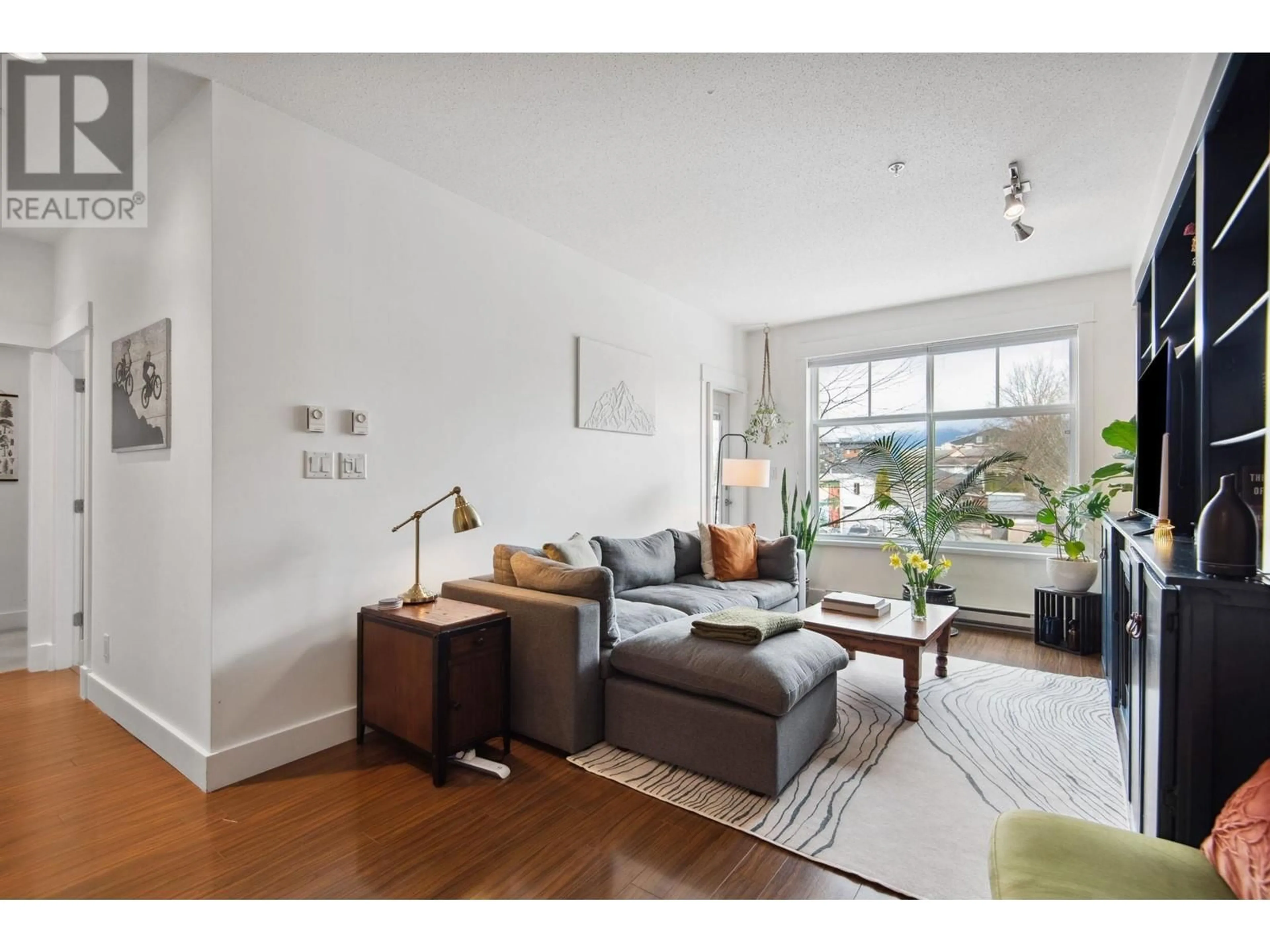 Living room with furniture, wood/laminate floor for 219 1336 MAIN STREET, Squamish British Columbia V8B0R2