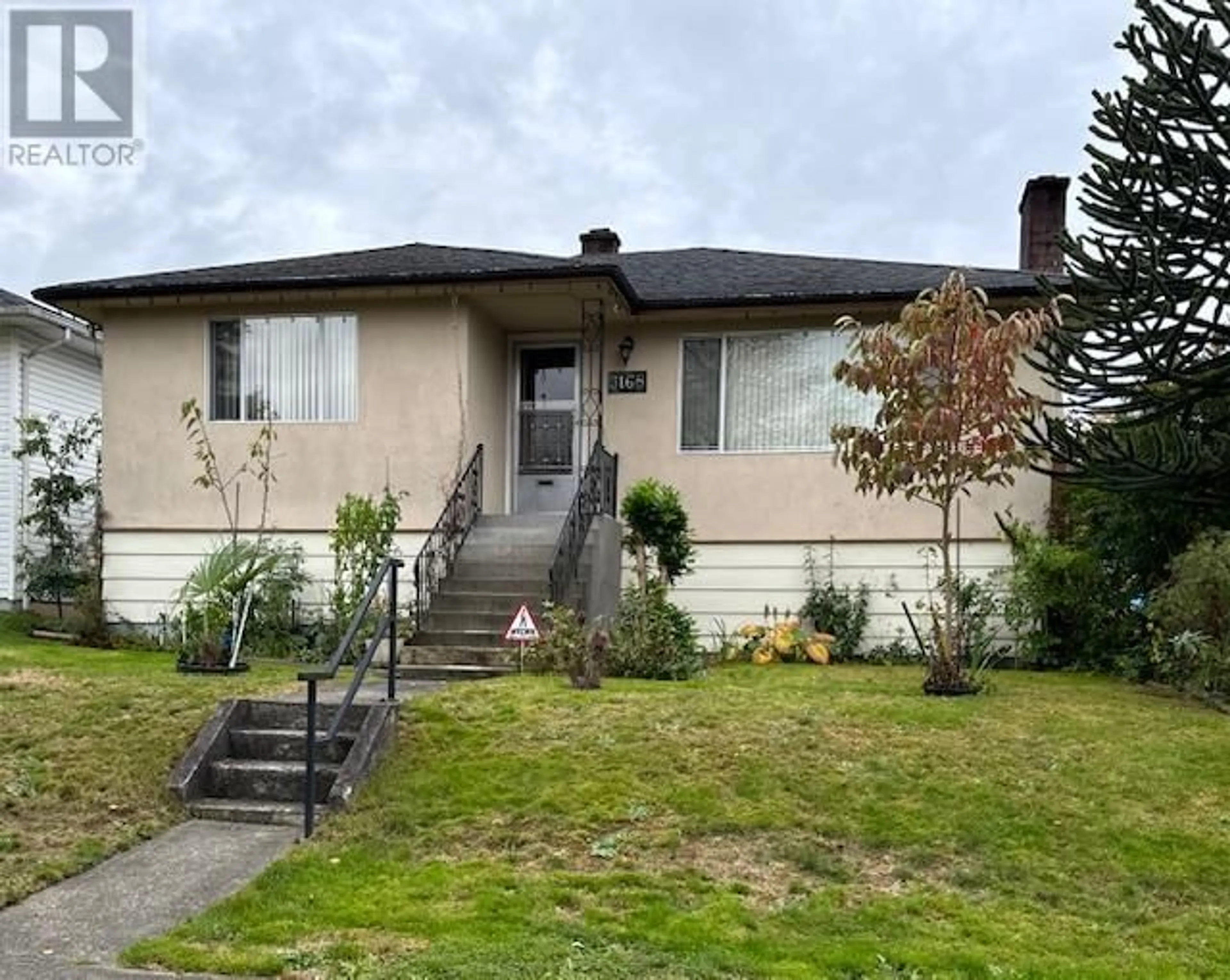 Home with vinyl exterior material, street for 3168 16TH AVENUE, Vancouver British Columbia V5M2M6