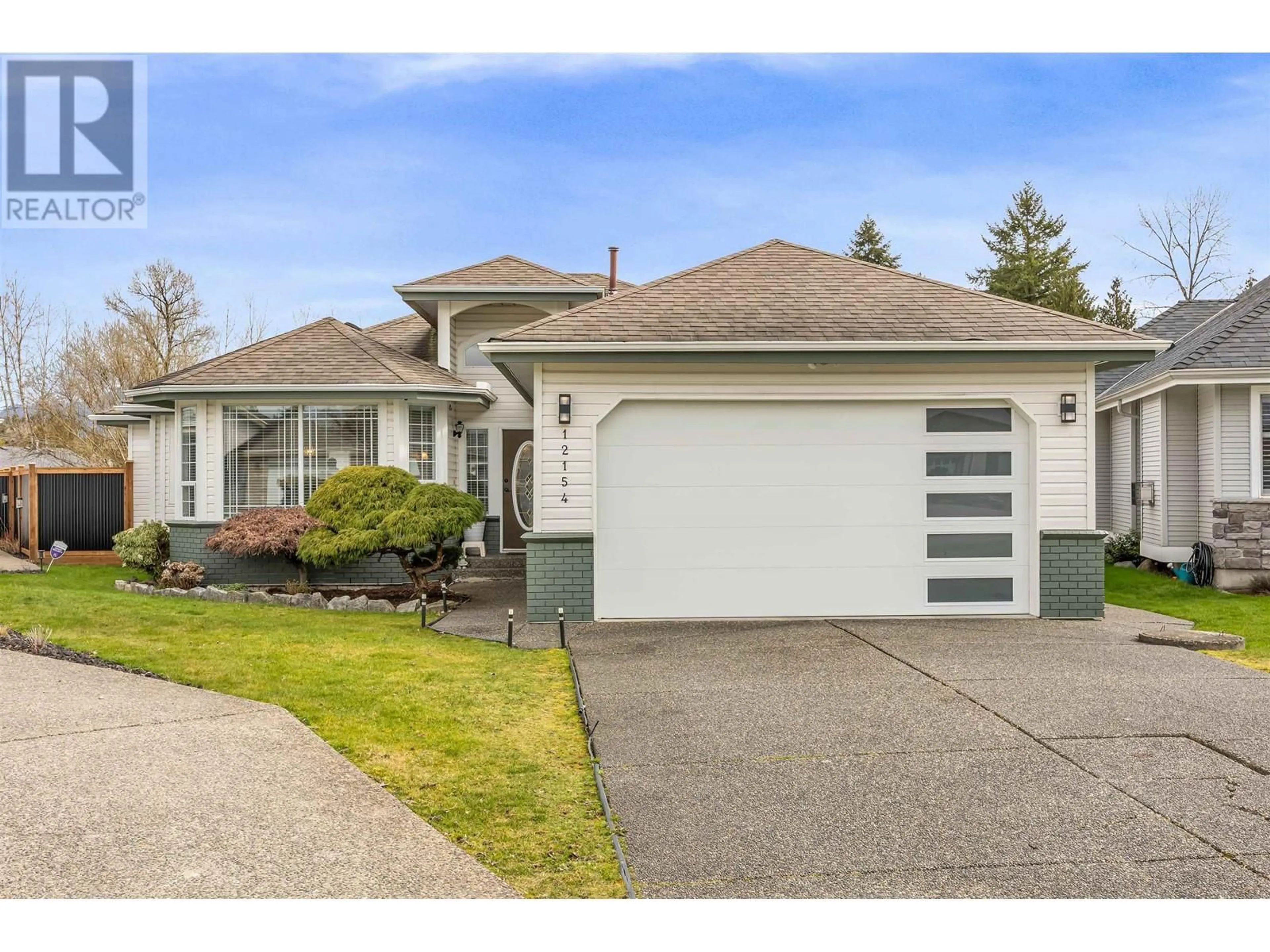 Home with vinyl exterior material, street for 12154 BLOSSOM STREET, Maple Ridge British Columbia V2X1C3