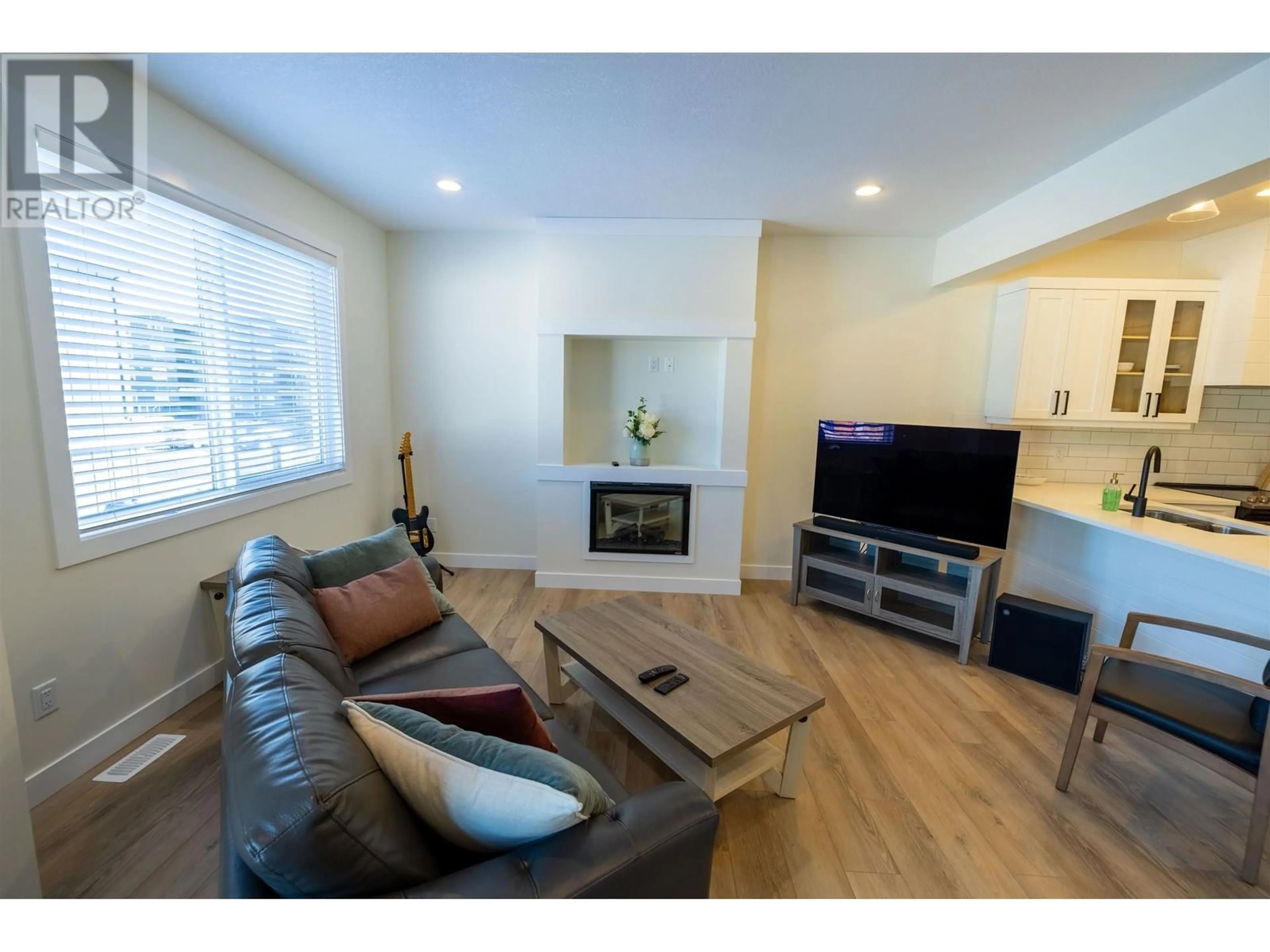 Living room with furniture, wood/laminate floor for 710 - 4274 22ND AVENUE, Prince George British Columbia V2N0J4