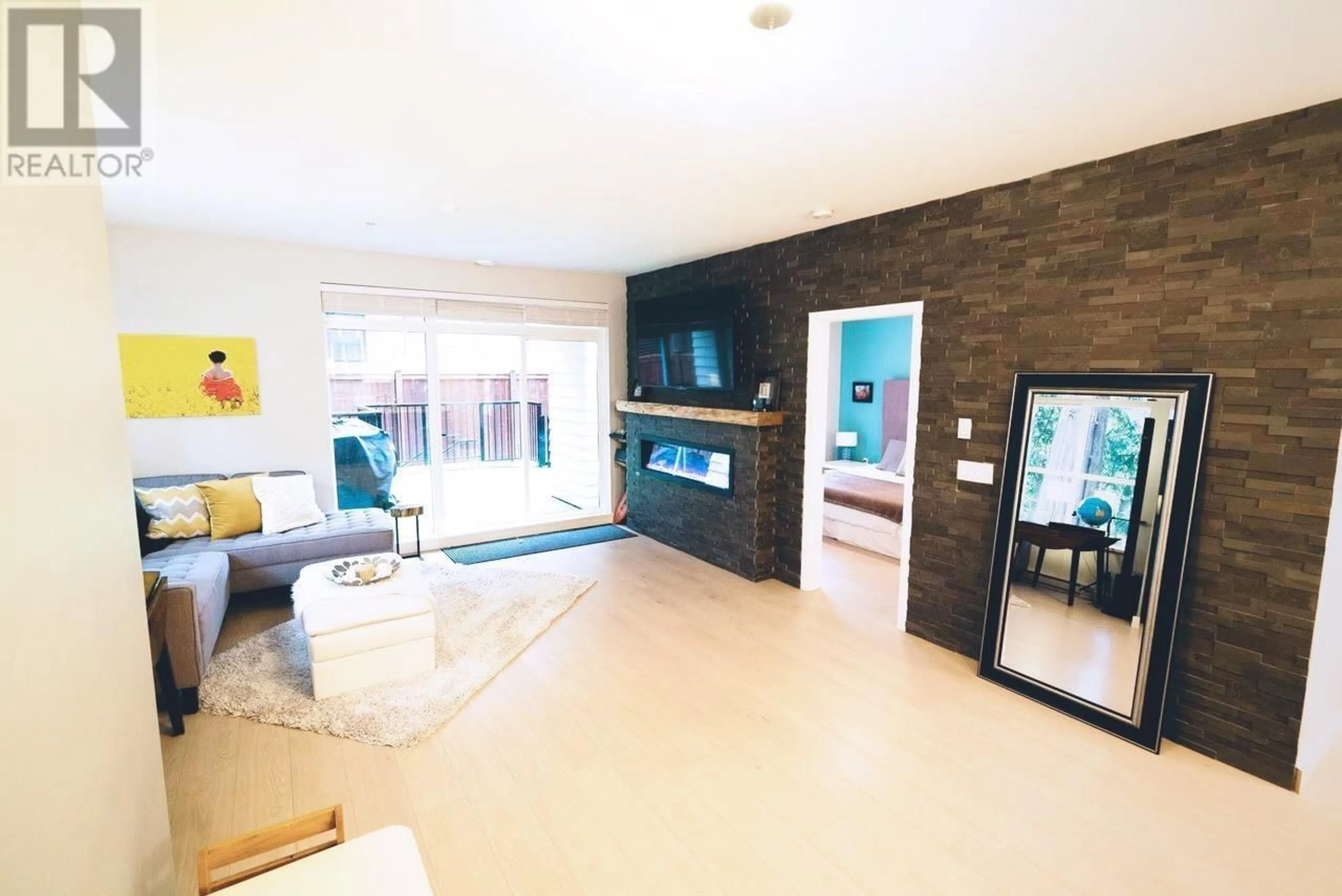 Living room with furniture, unknown for 112 - 3205 MOUNTAIN HIGHWAY, North Vancouver British Columbia V7K0A3