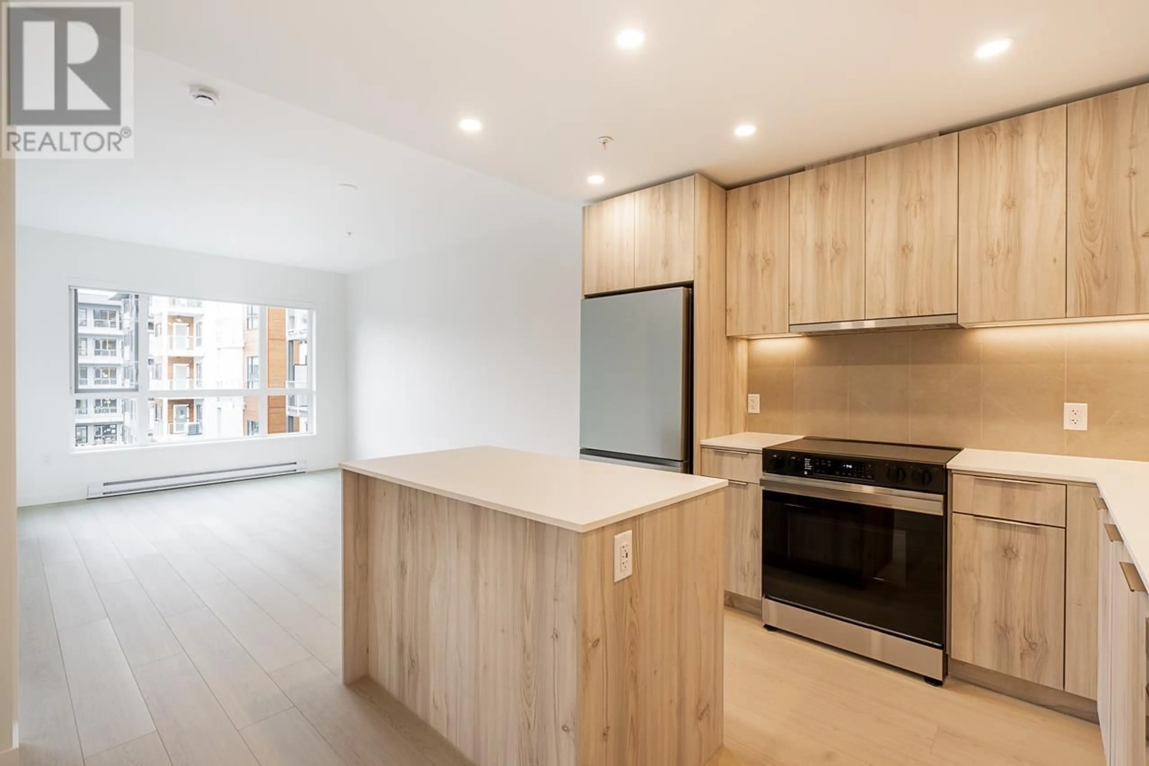 Open concept kitchen, wood/laminate floor for 403 - 3596 MALSUM DRIVE, North Vancouver British Columbia V7G0B5